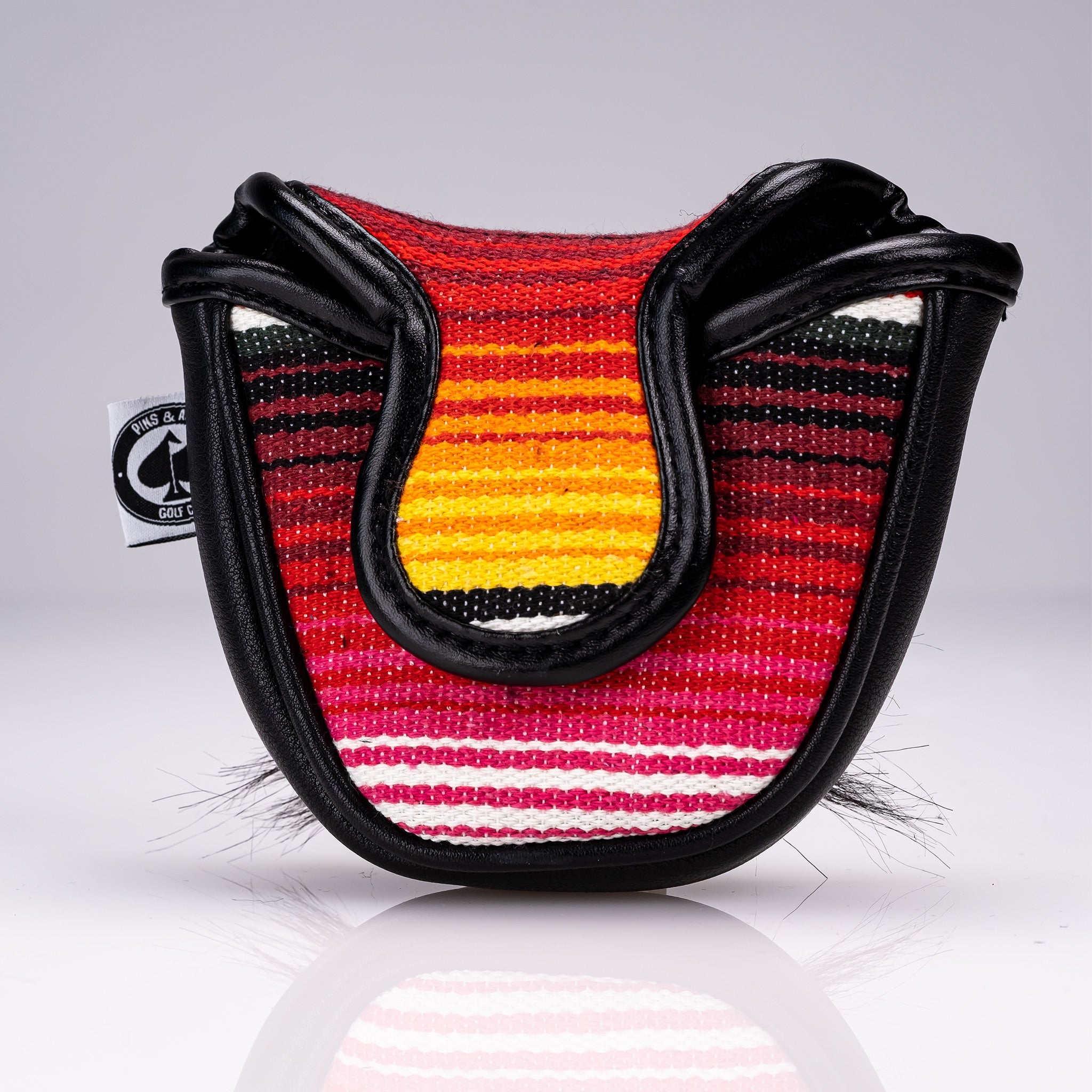 Black mallet putter cover featuring a mustache sugar skull design.