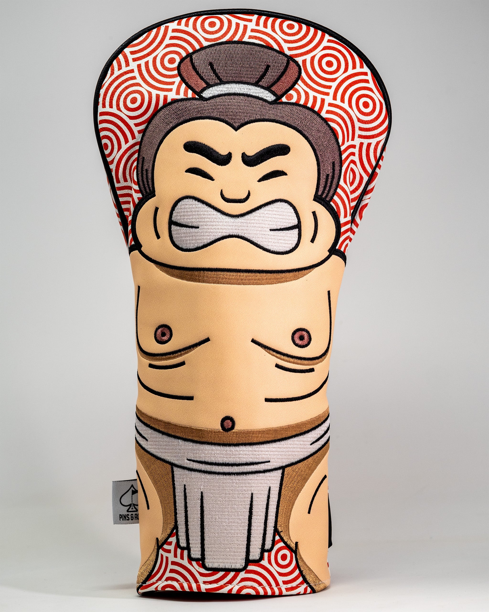 Sumo wrestler-themed driver cover with a cartoon face, muscular torso, and traditional loincloth design.