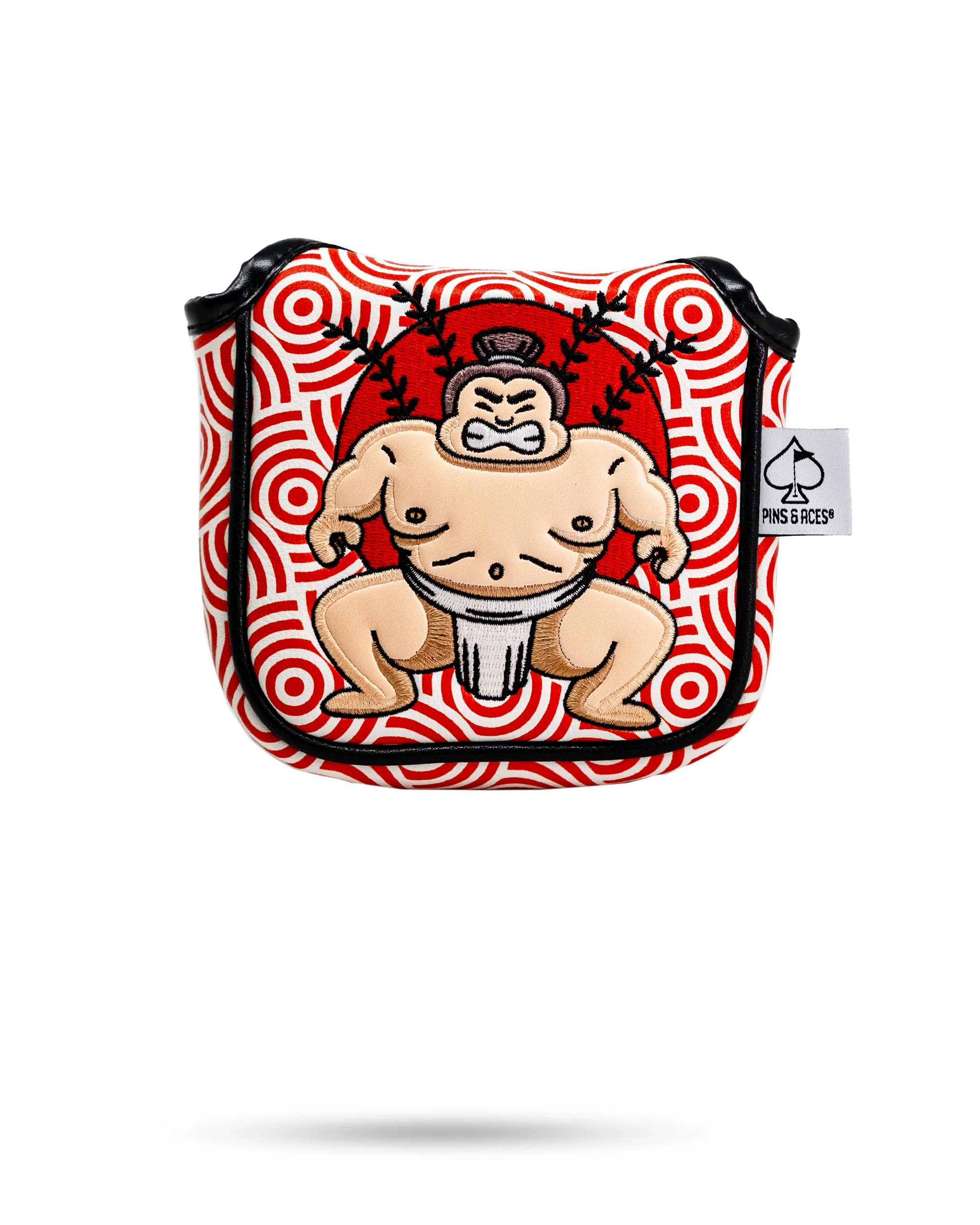 Sumo wrestler embroidered patch on a red and white patterned mallet putter cover with black piping and a Pins and Aces tag.
