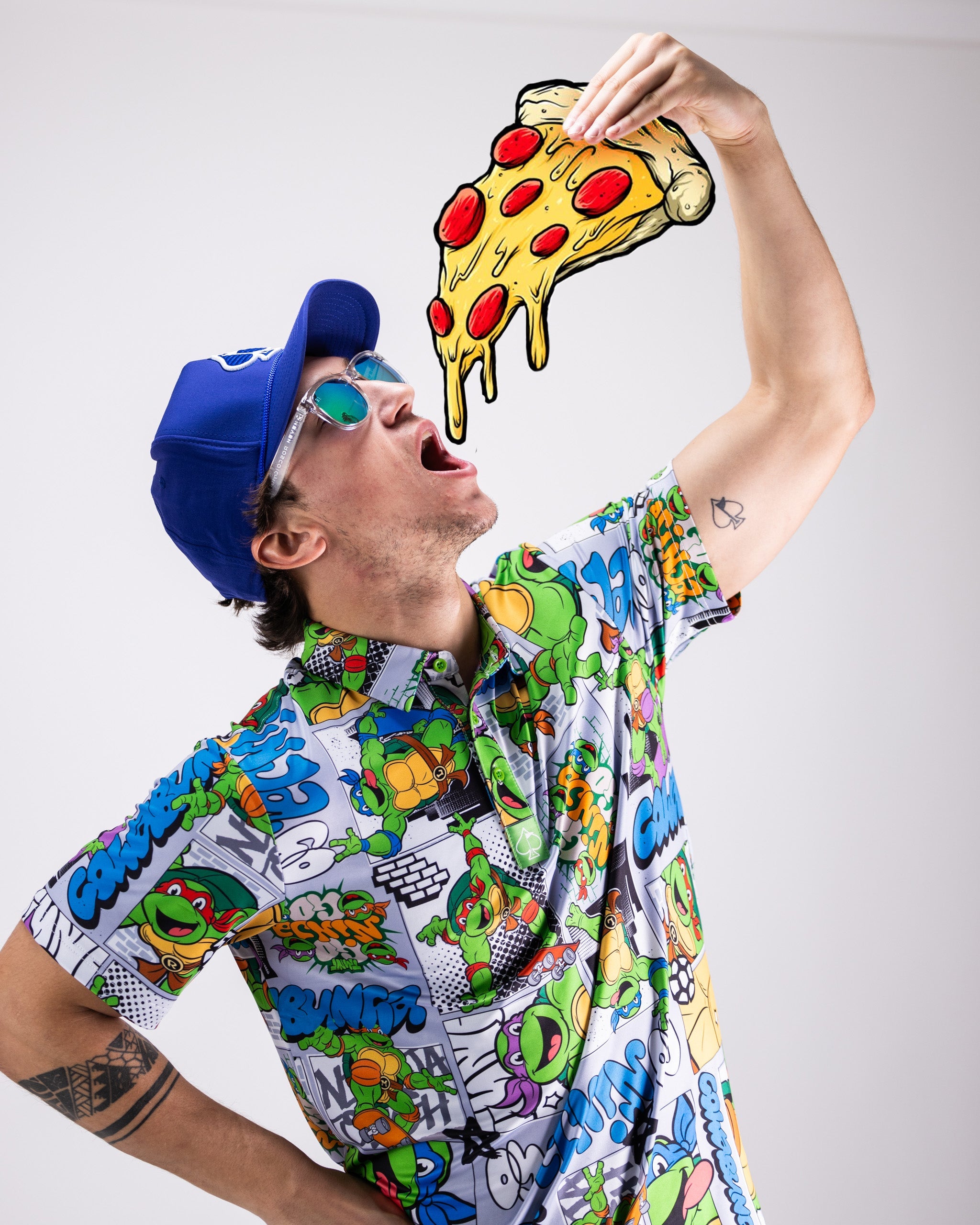 TMNT comic strip polo featuring colorful characters from the Teenage Mutant Ninja Turtles series.