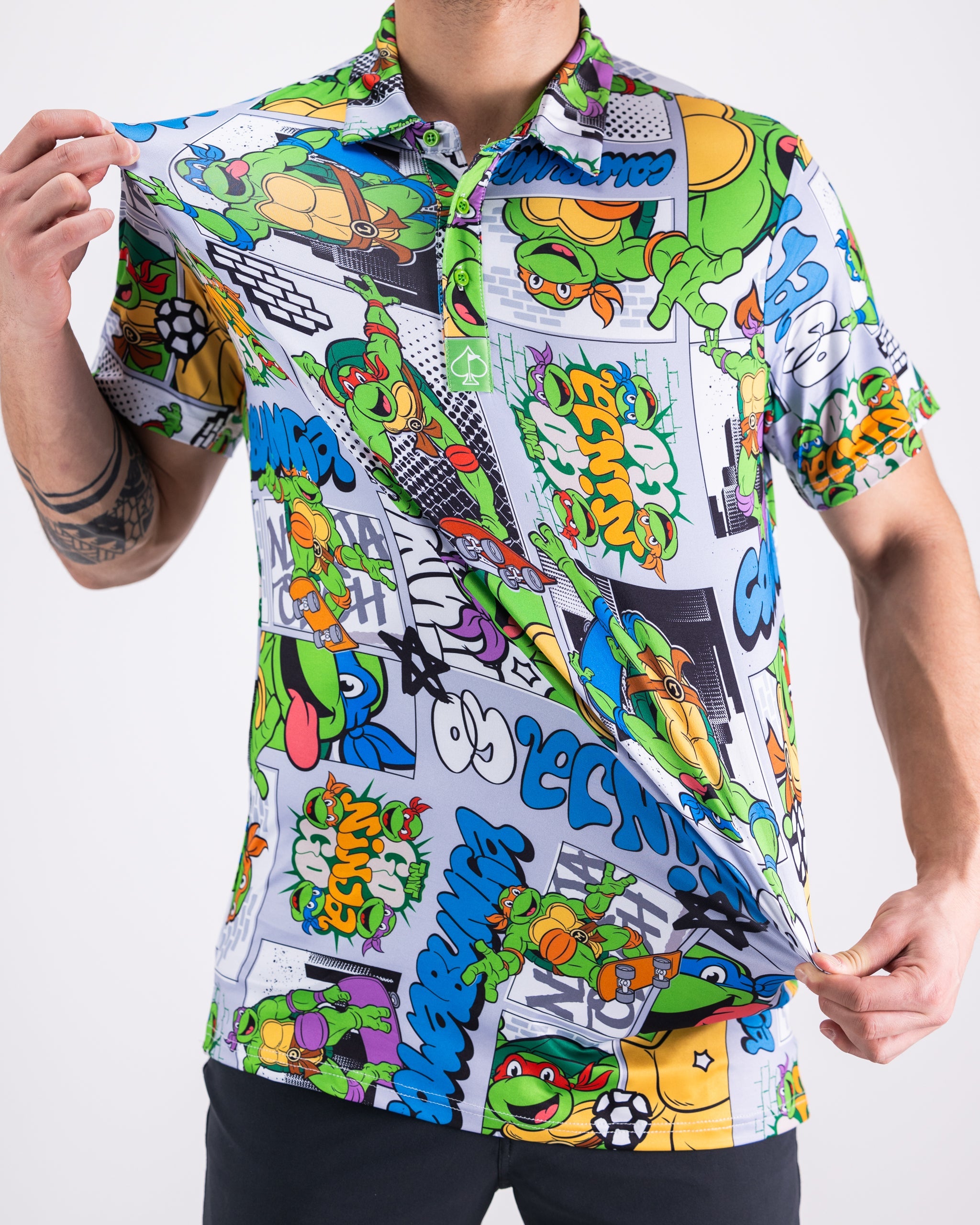 TMNT comic strip design featuring iconic Teenage Mutant Ninja Turtles characters printed on a polo shirt.