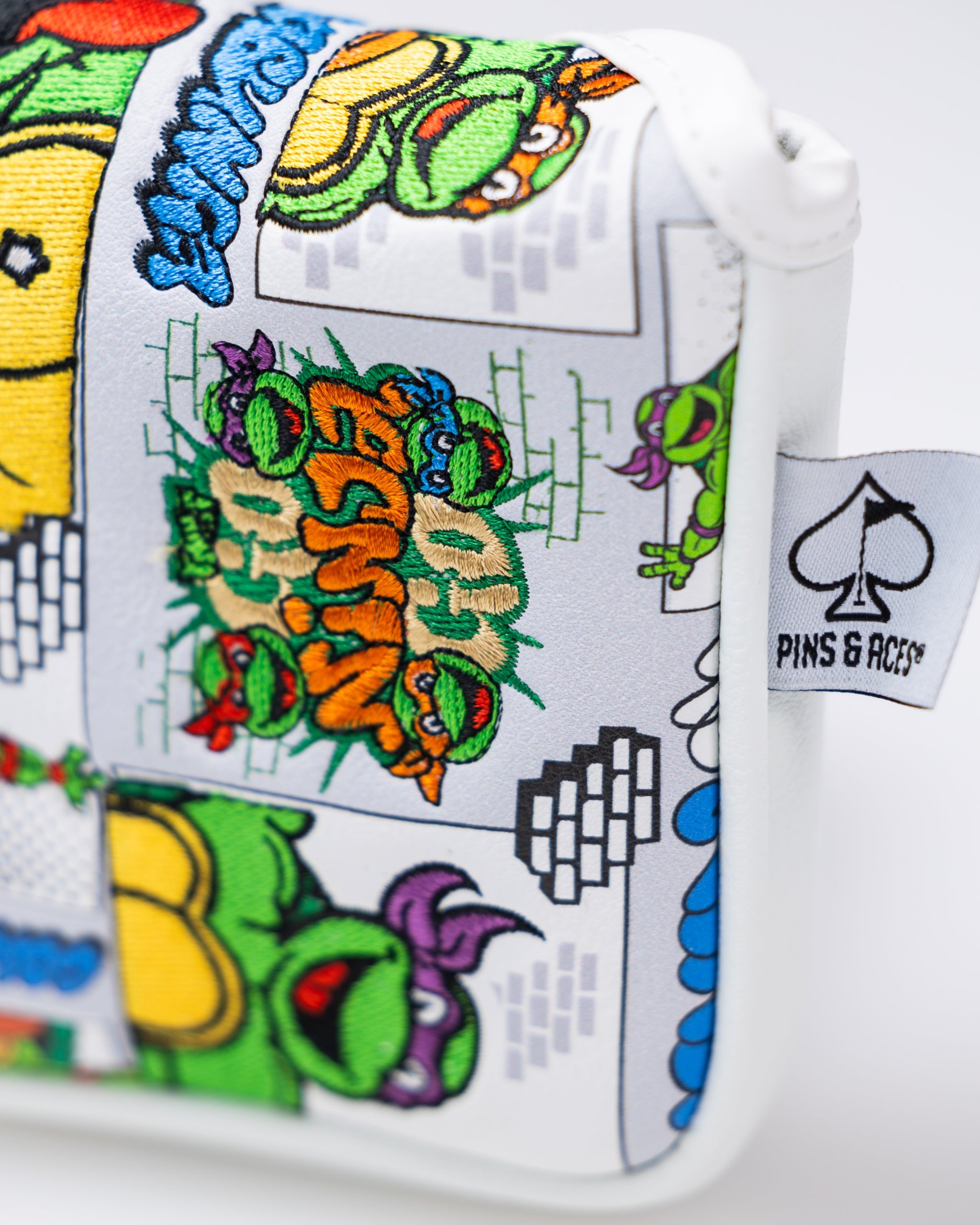 TMNT Comics mallet cover featuring colorful artwork of Teenage Mutant Ninja Turtles in action.