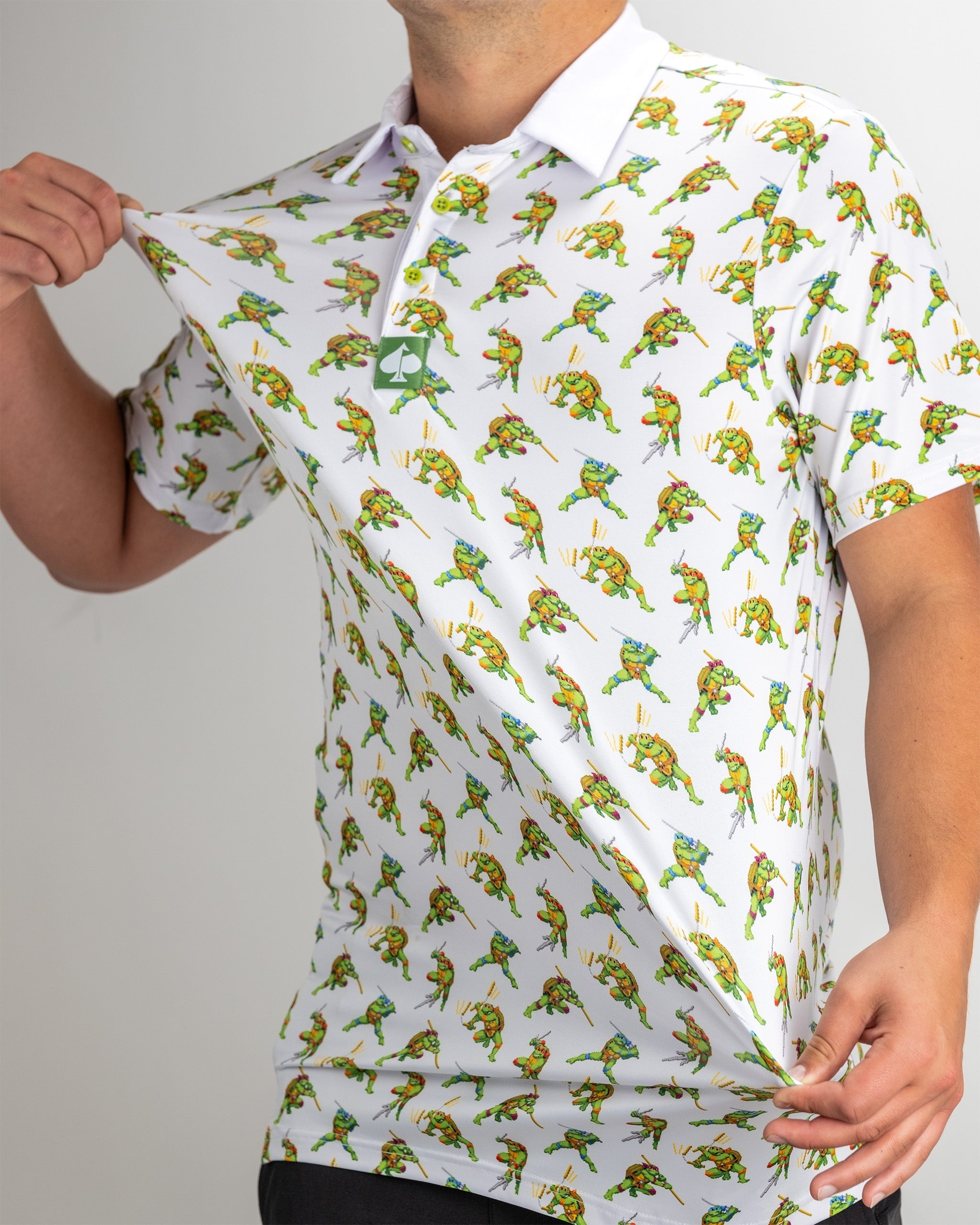 "TMNT Cowabunga Classic 8-Bit graphic t-shirt featuring retro-style Teenage Mutant Ninja Turtles design."