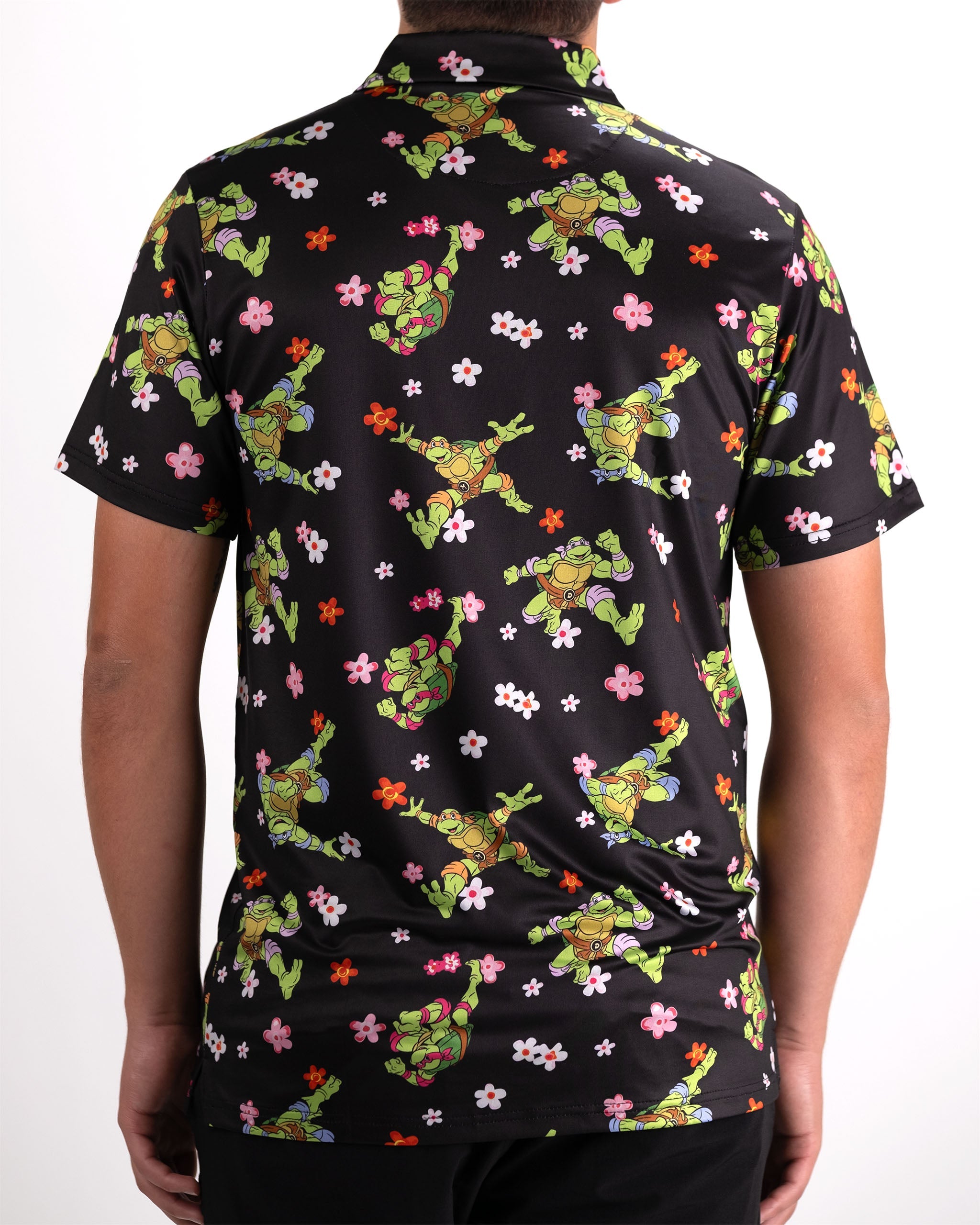 TMNT Turtle Flower Power graphic t-shirt featuring vibrant colors and a floral design with the Teenage Mutant Ninja Turtles.