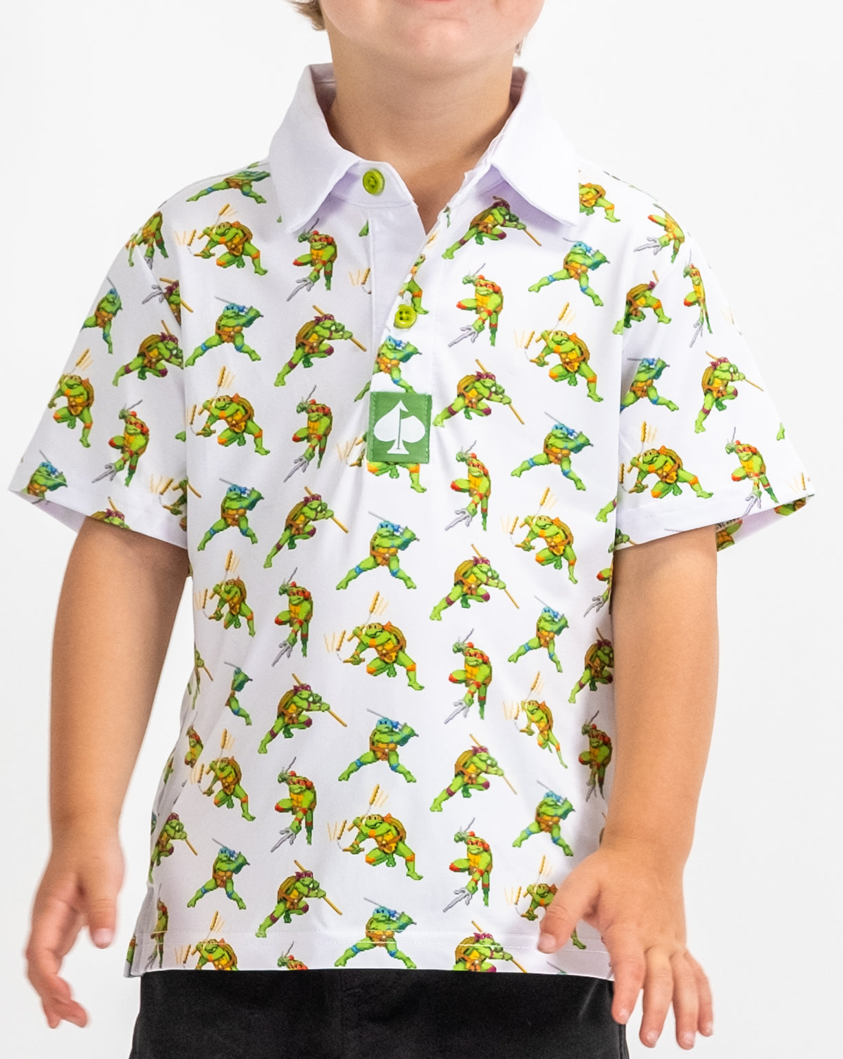 Youth TMNT Cowabunga Classic 8-Bit polo shirt featuring retro video game style graphics of Teenage Mutant Ninja Turtles.