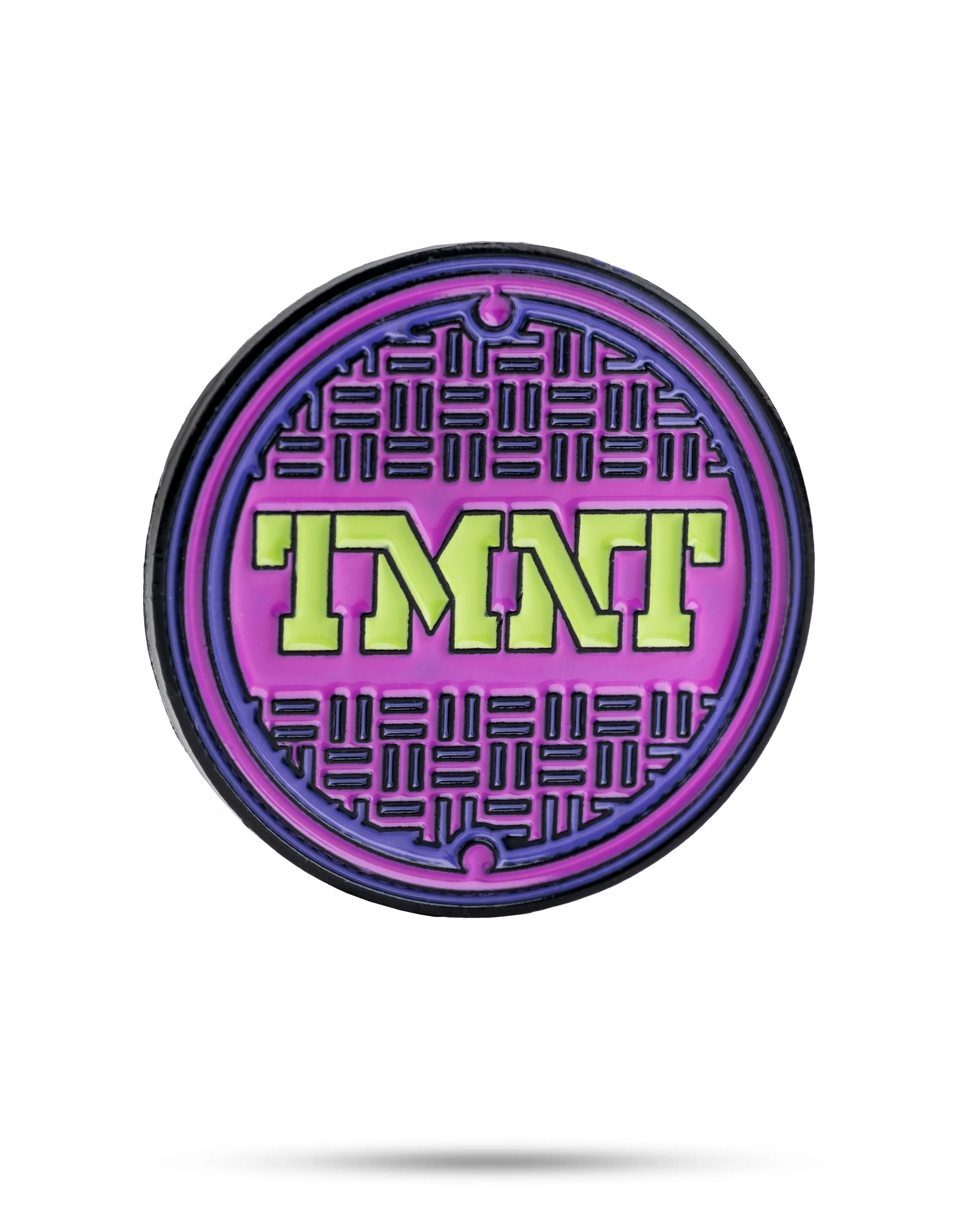 TMNT sewer cover ball marker featuring a colorful design with the Teenage Mutant Ninja Turtles logo.