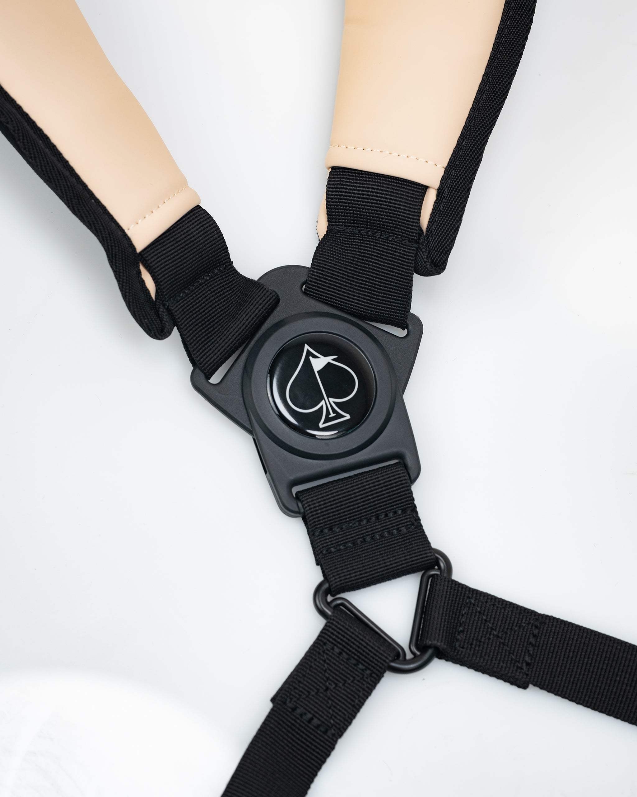 Bold black golf headcover with a white spade logo, paired with adjustable straps for a standout golf accessory.