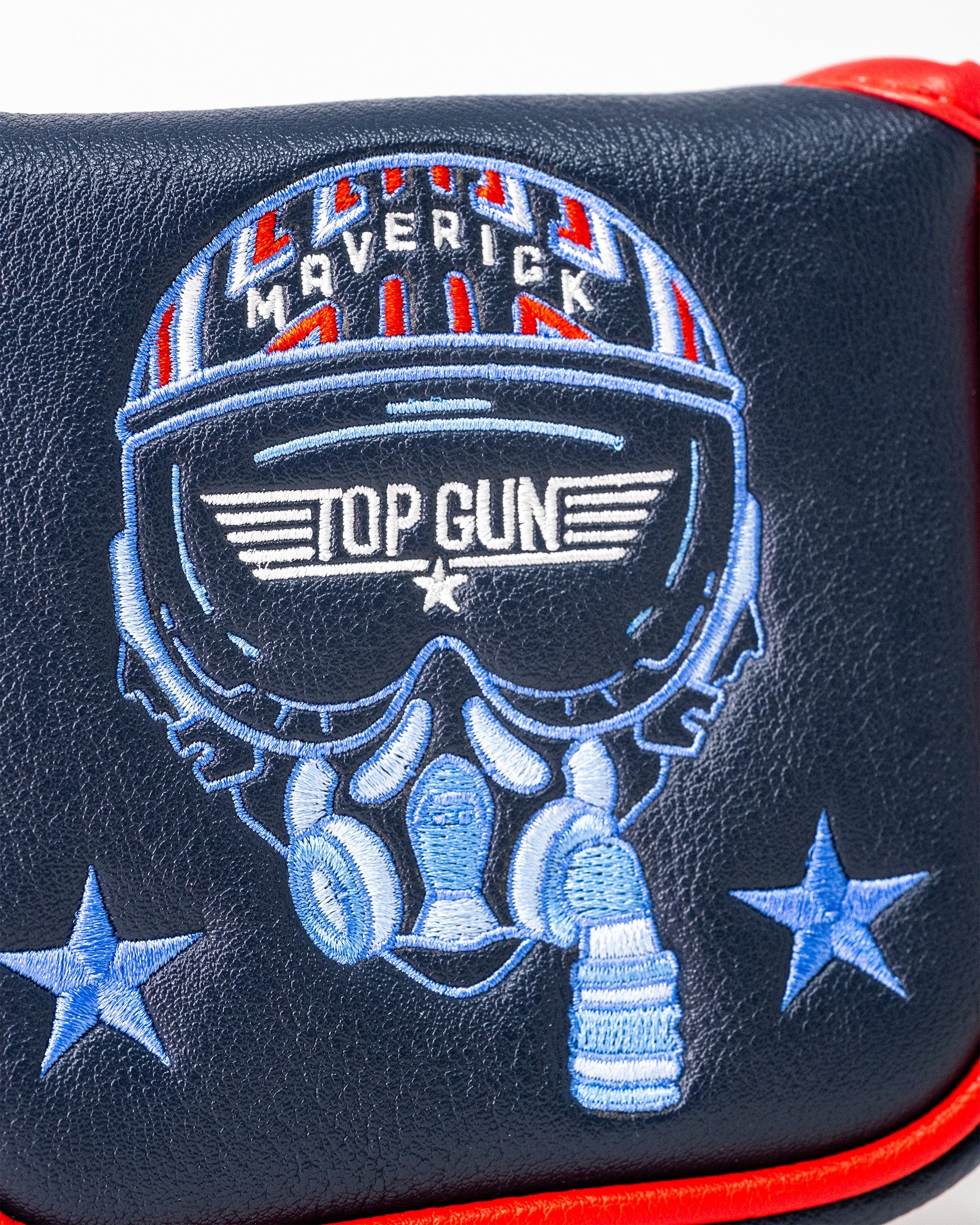 Embroidered Top Gun Maverick themed mallet golf headcover featuring a skull with sunglasses, headphones, and stars on a black background.