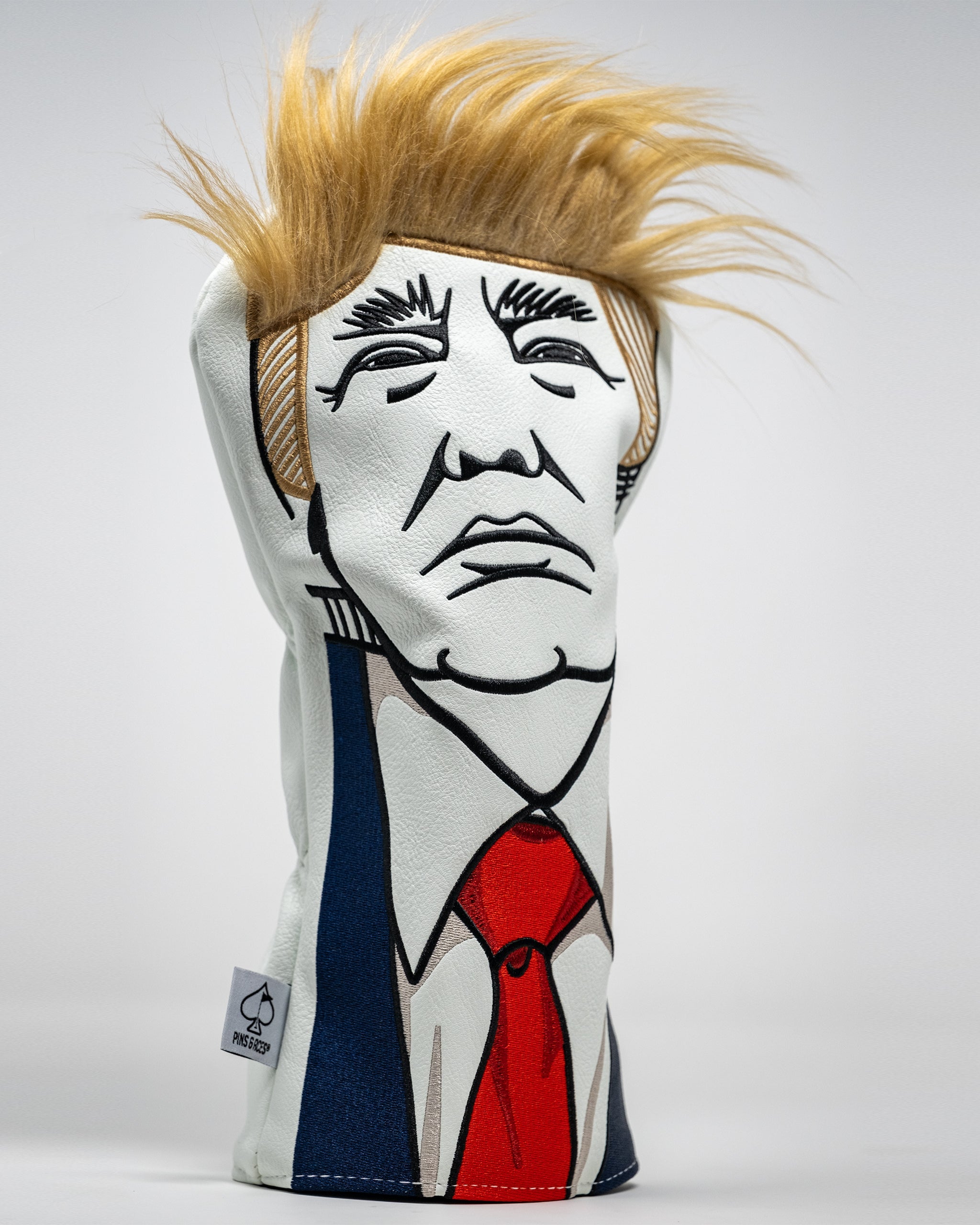 Trump driver head cover with a bold design featuring the former president's likeness, perfect for golf enthusiasts.