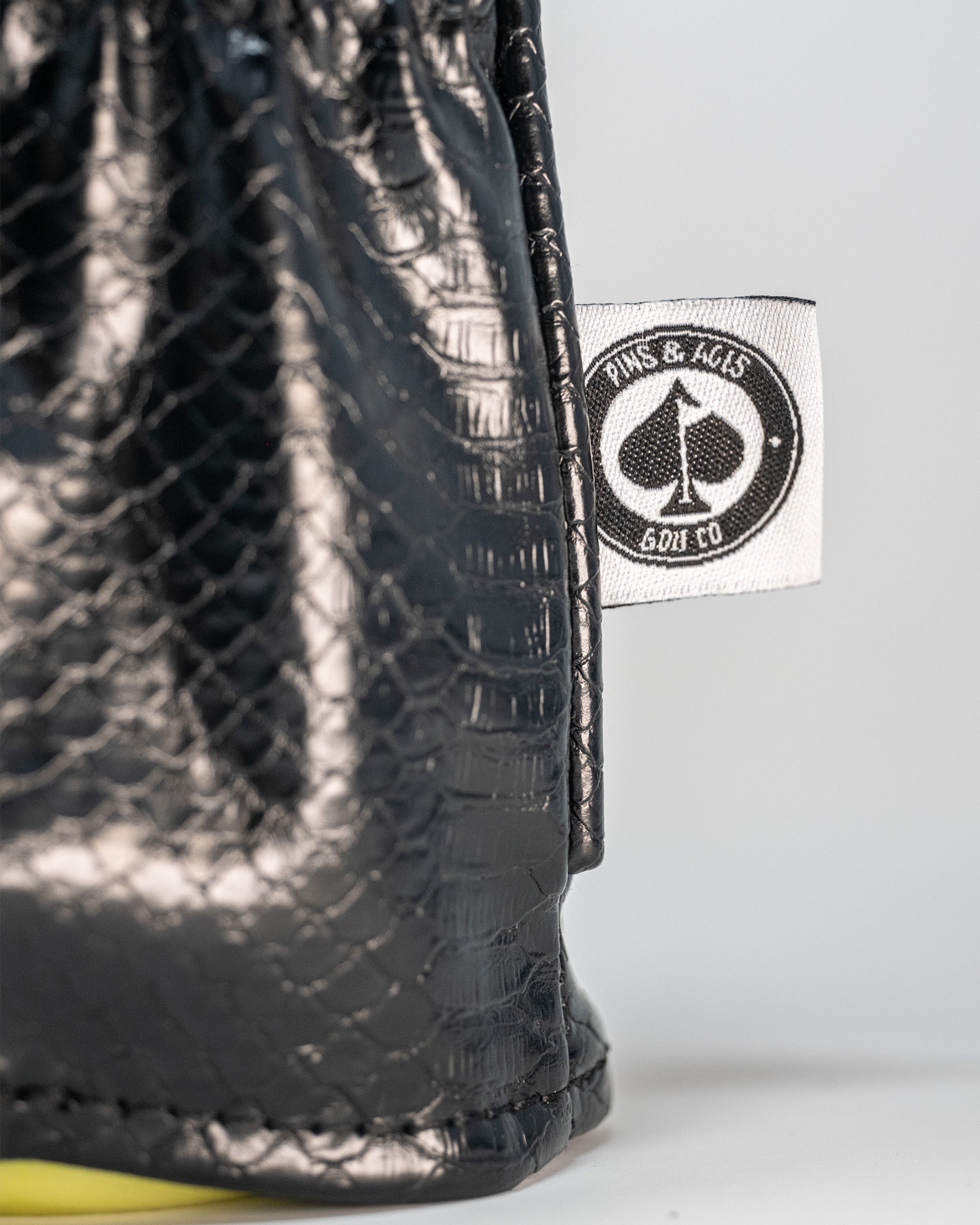 Venom driver cover featuring a black and yellow design with a menacing Venom character graphic.