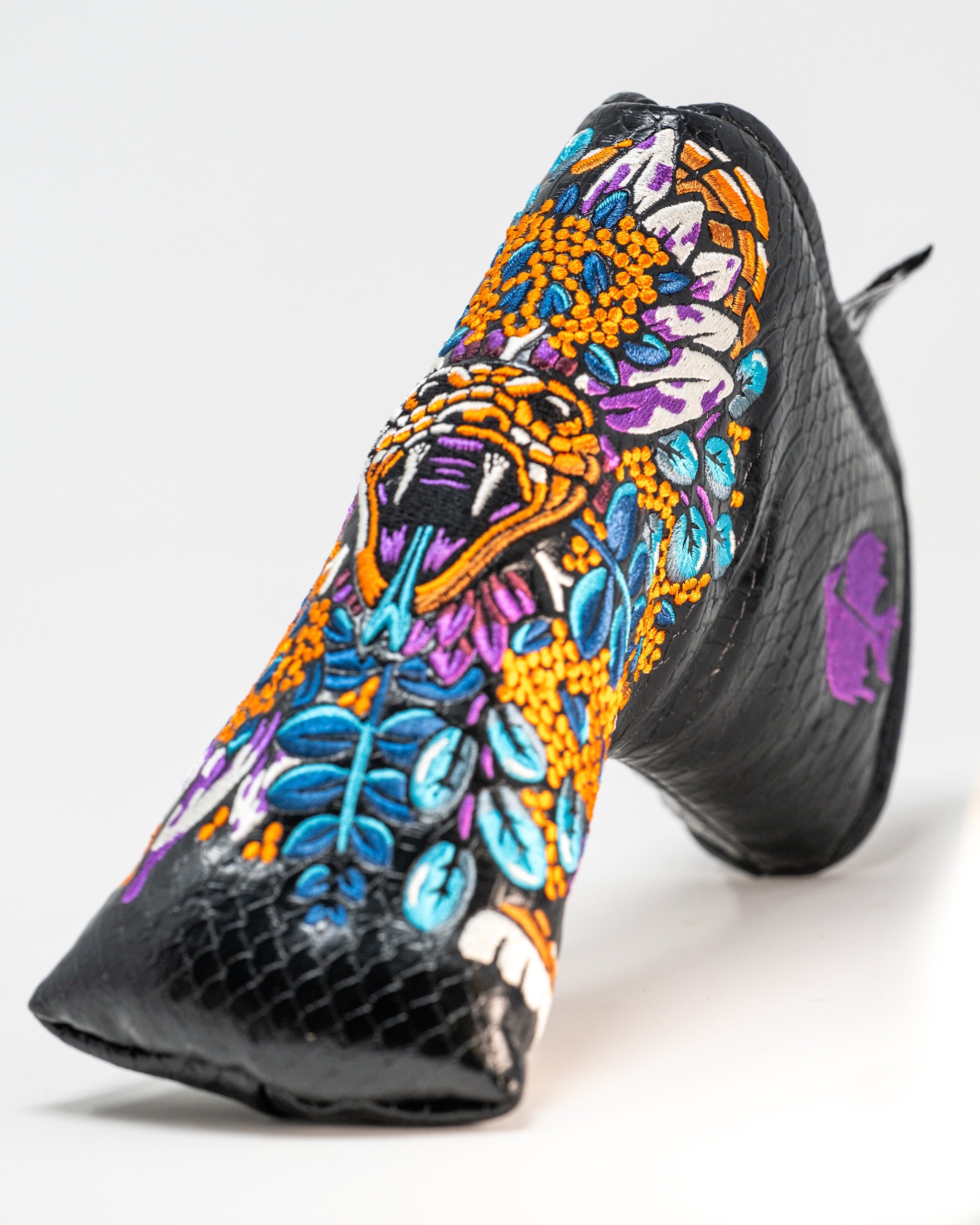 Venom Blade Putter Cover featuring a sleek black design with venomous green accents and a snake graphic.