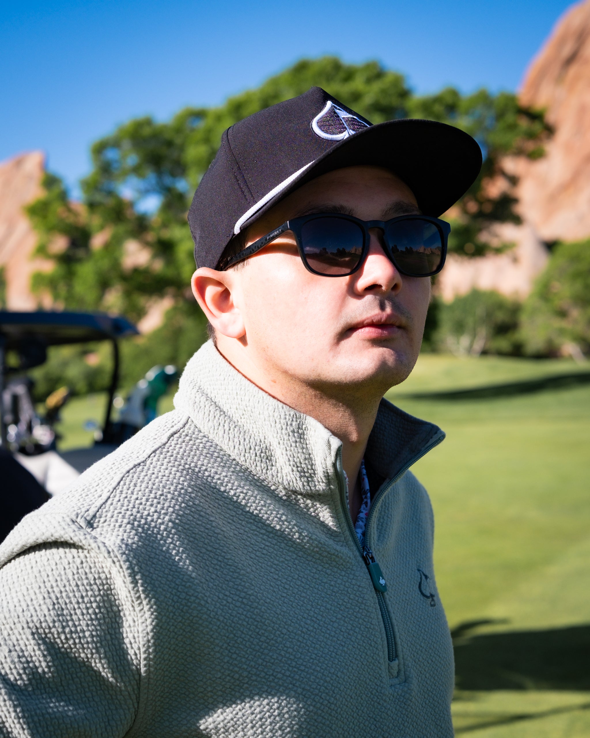 Olive green Player Preferred™ waffle knit pullover displayed in a lifestyle setting.