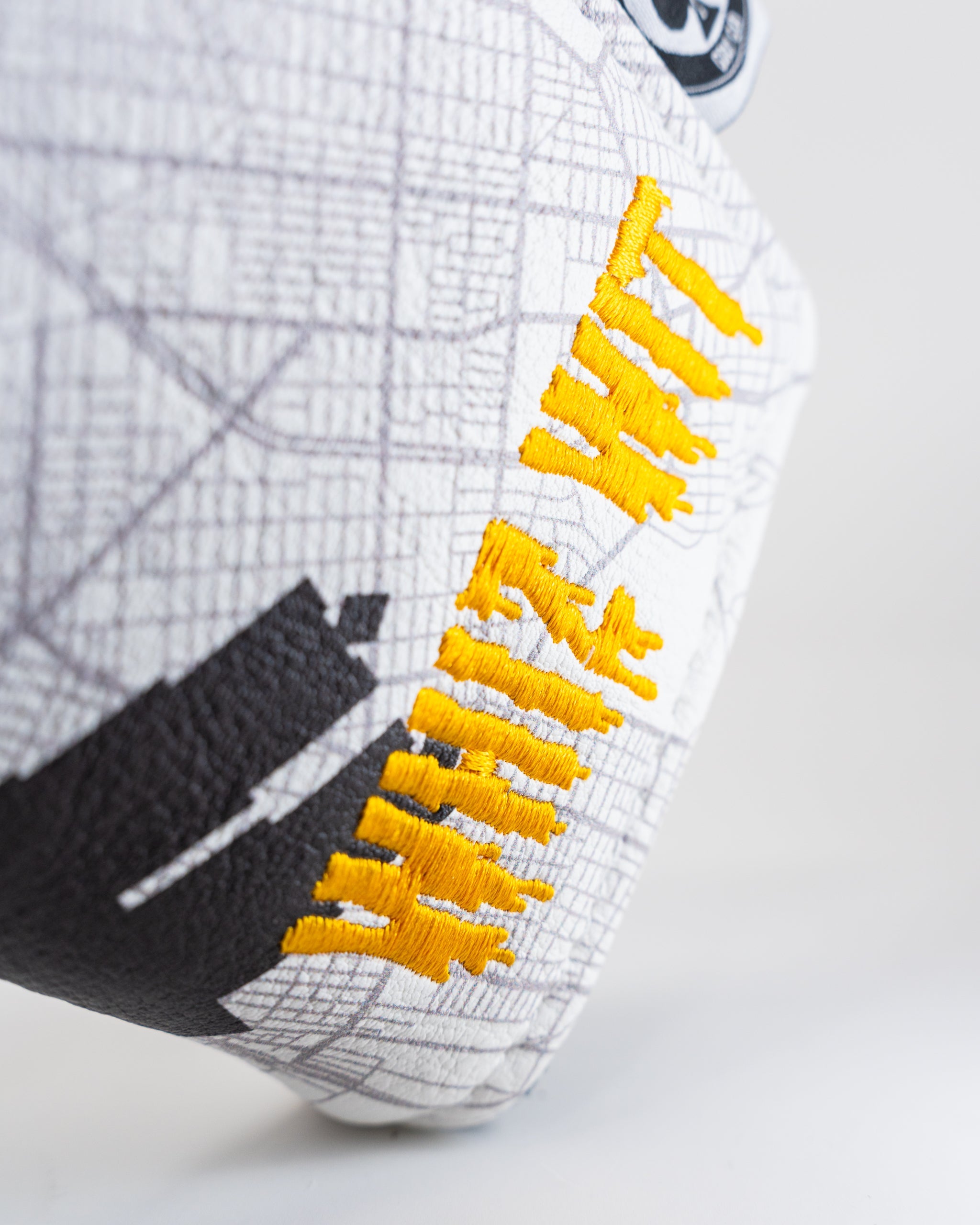 Whiz Wit Blade Putter Cover featuring a vibrant design with colorful graphics and a secure fit for standard blade putters.