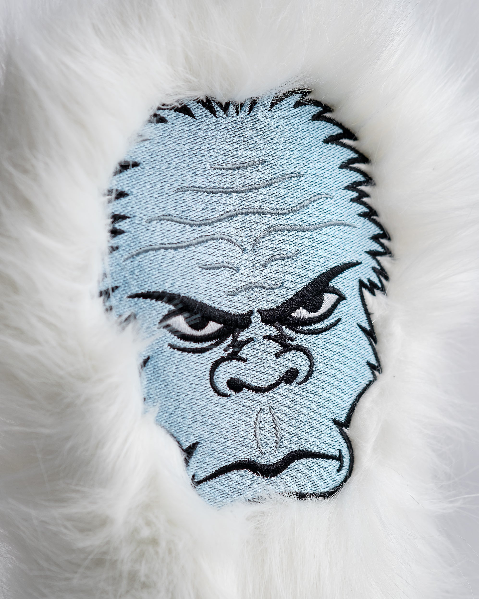 Yeti driver head cover featuring a playful yeti design with vibrant colors and a textured finish.