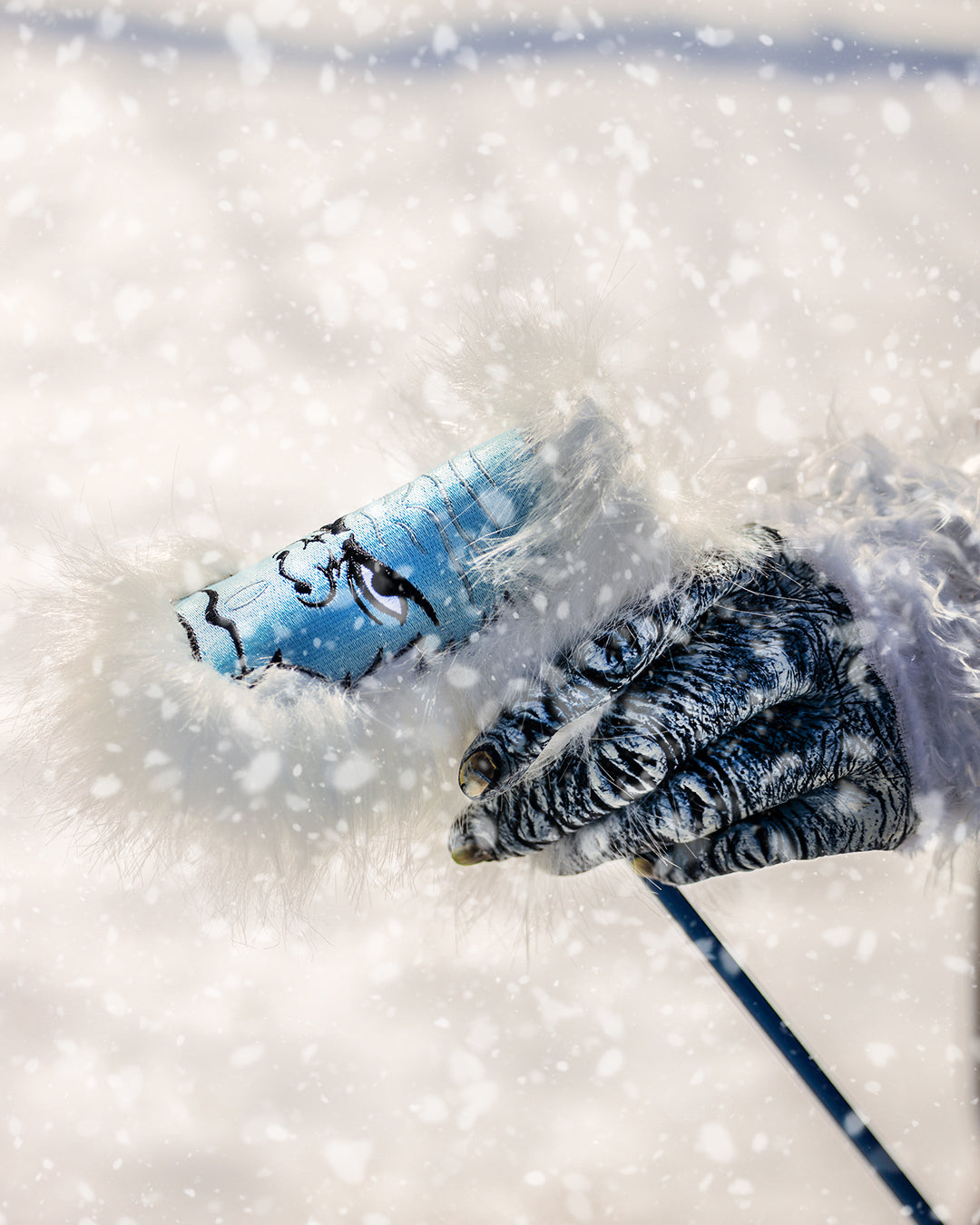 Yeti Blade Putter Cover featuring a vibrant design with cartoon yetis, crafted for optimal protection and style.