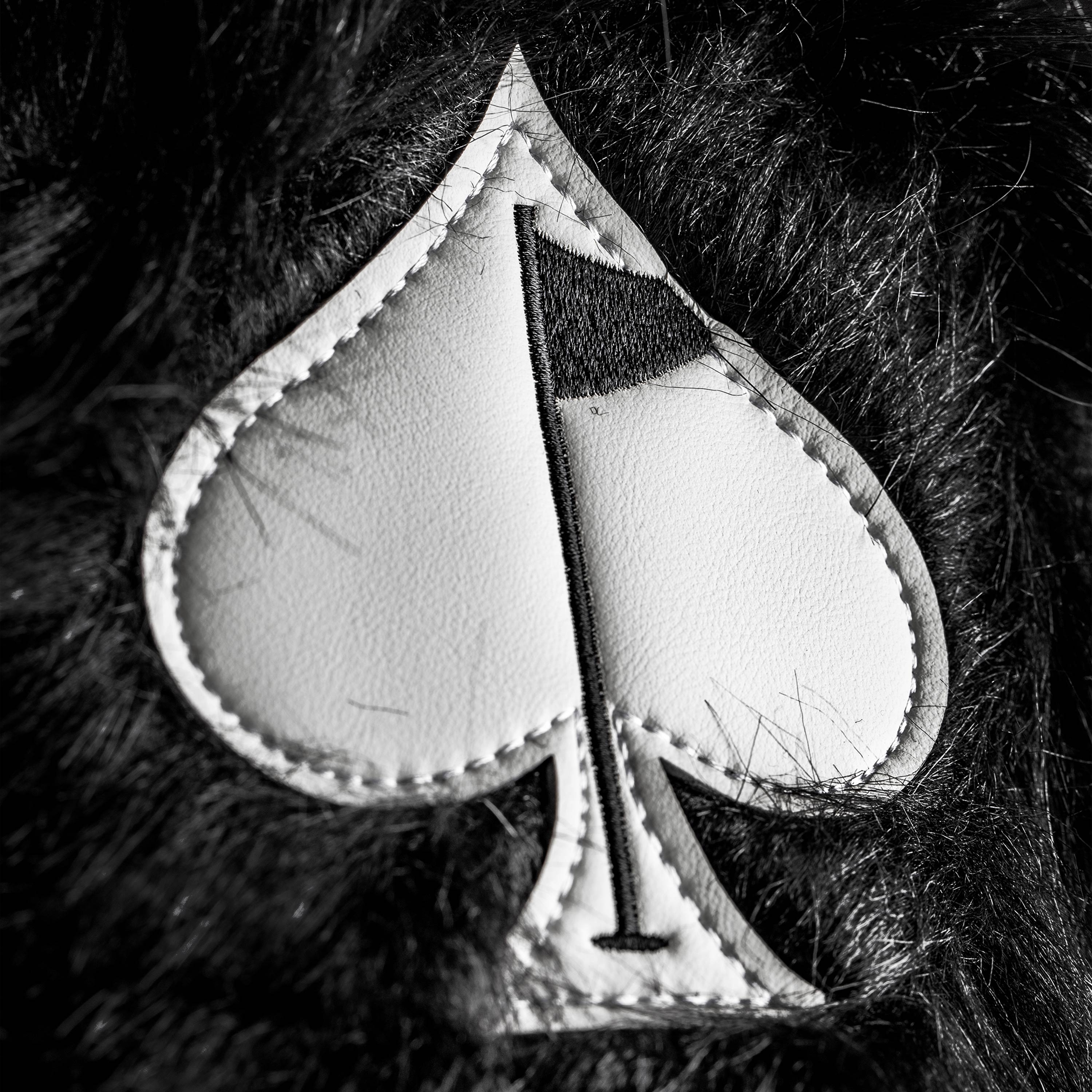 Black fuzzy driver cover for golf clubs with a stylish and soft design.