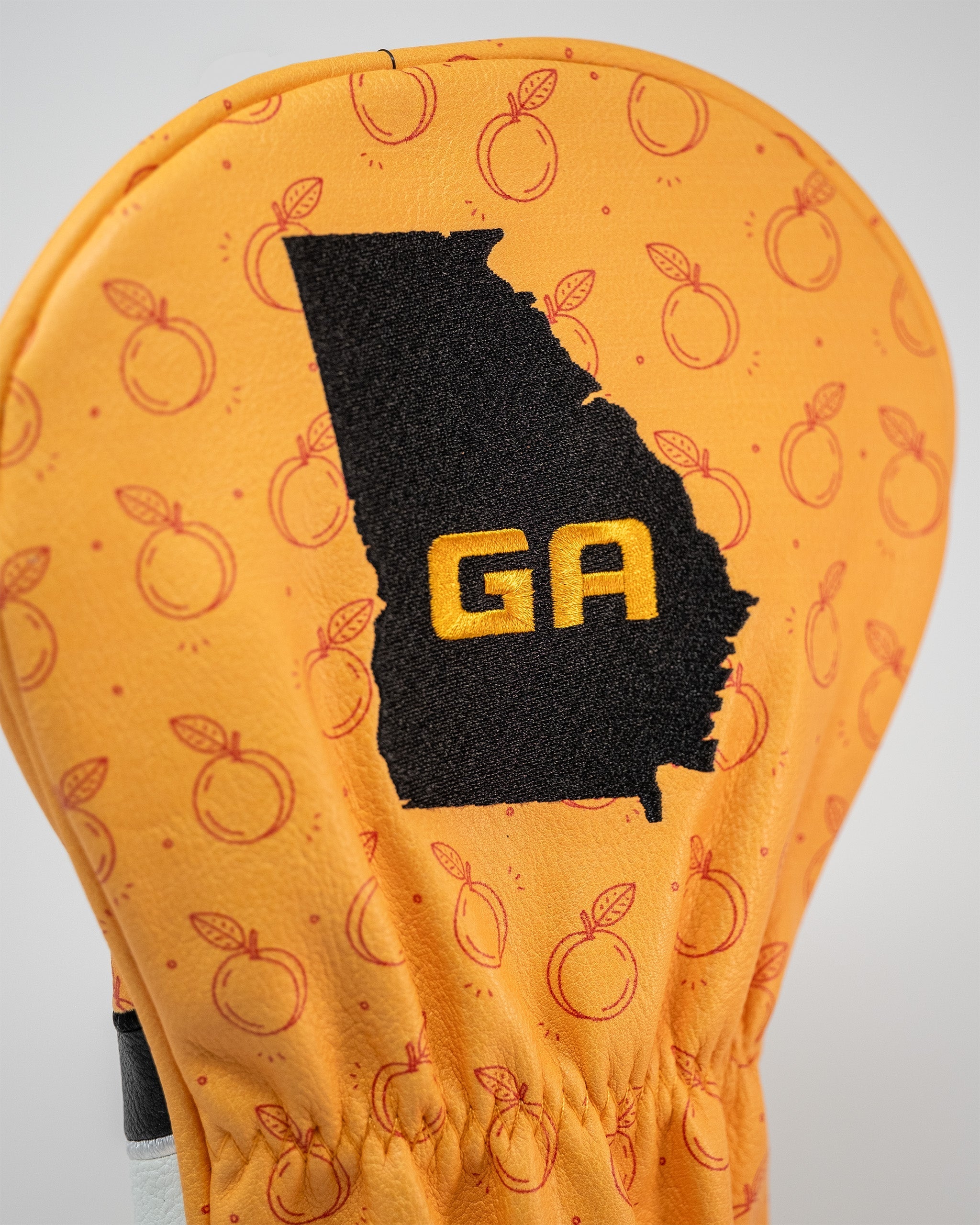Bold orange driver cover featuring a Georgia state outline and "GA" lettering, perfect for golfers wanting to stand out.