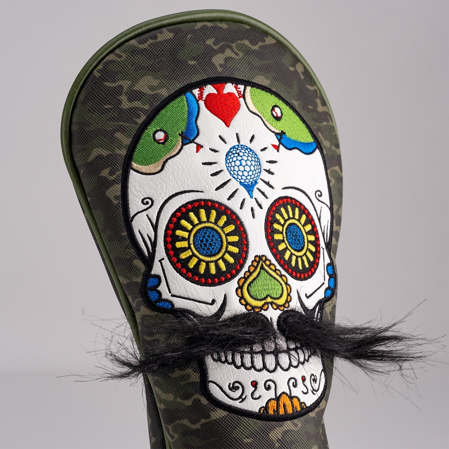 Bold green camo fairway cover featuring a colorful mustache sugar skull design with intricate details and a faux mustache.