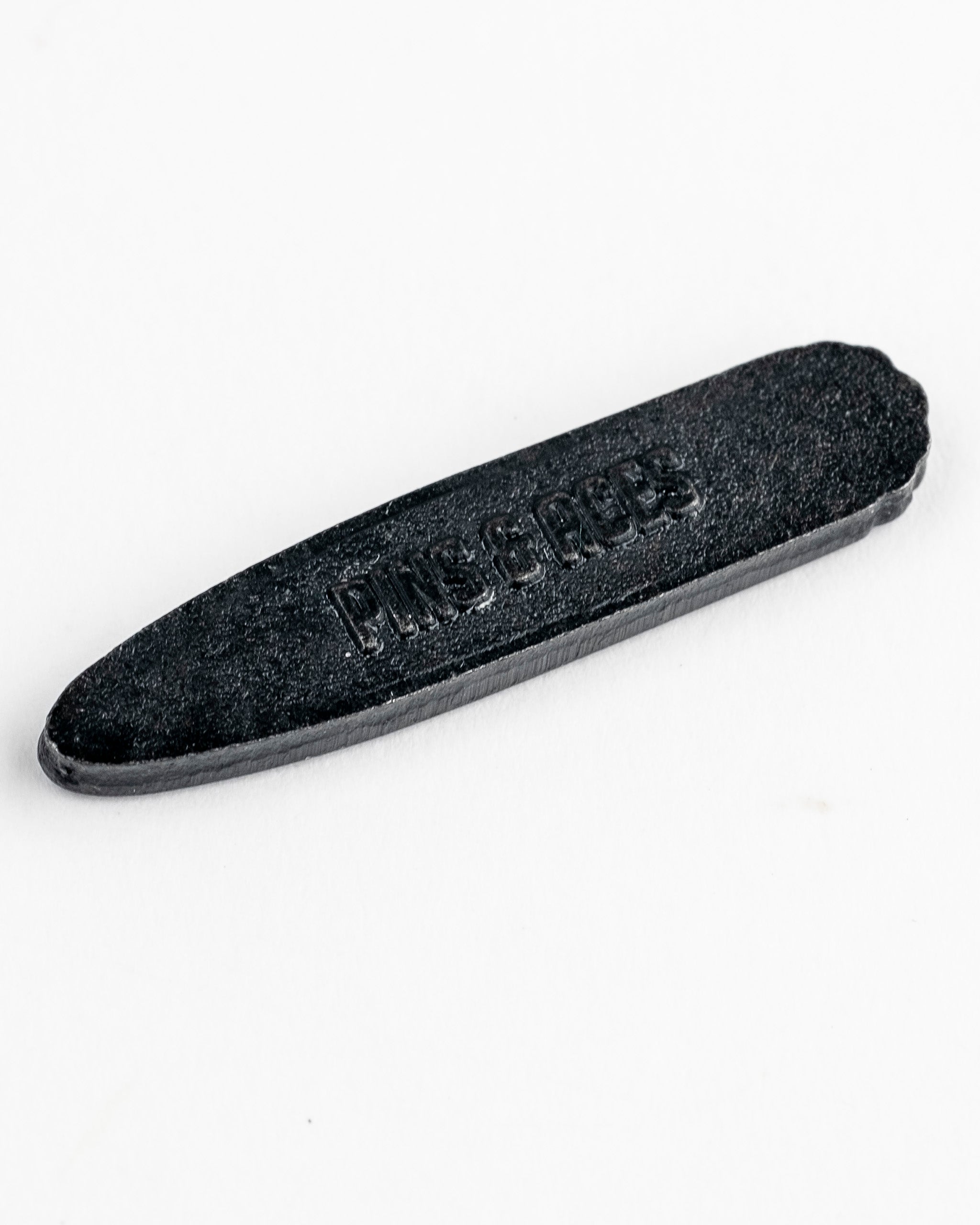 A black 420 Joint Ball Marker with embossed lettering "Pins & Pots" on a plain white background.