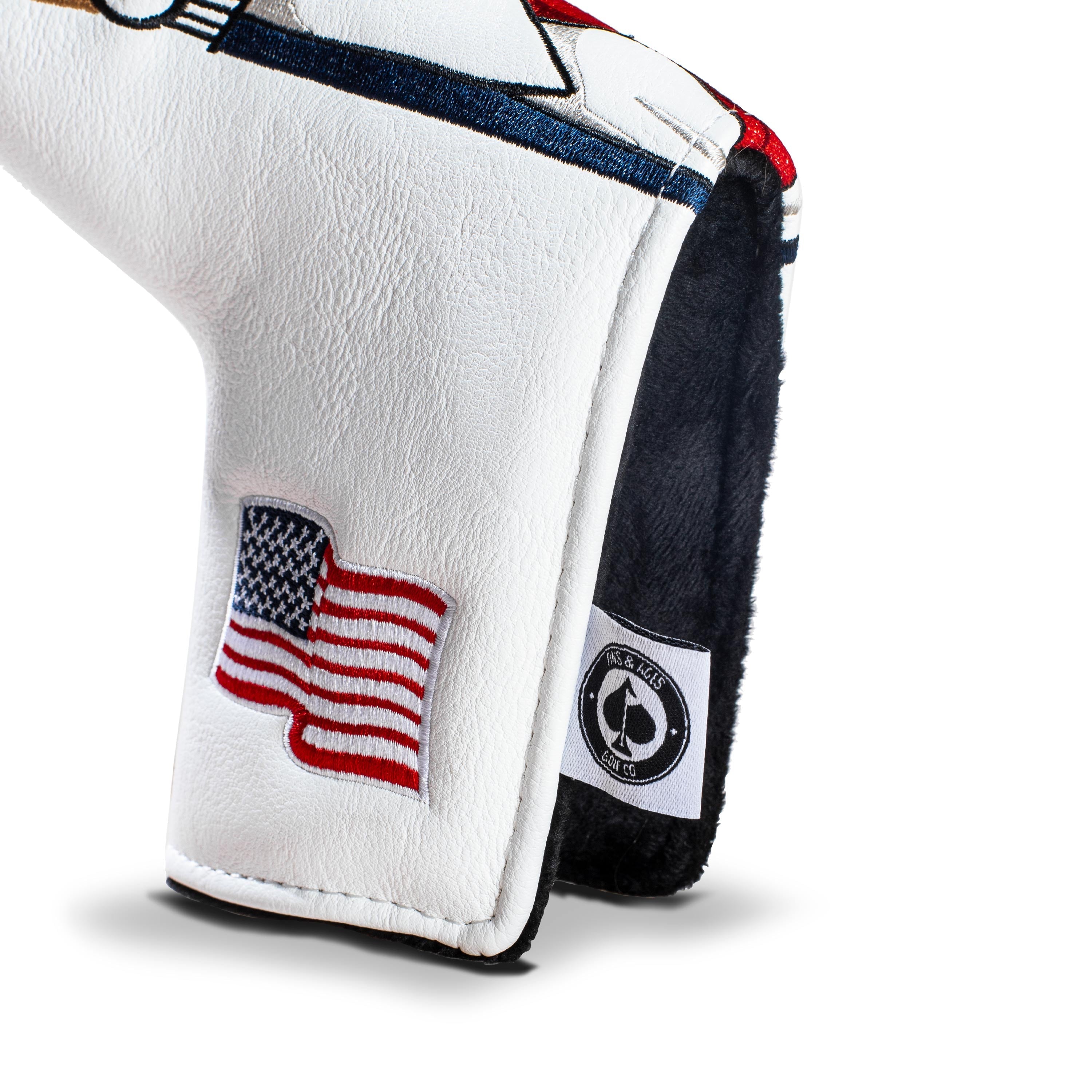 Bold Trump-themed blade putter cover featuring a patriotic design with an American flag, perfect for standout golfers.