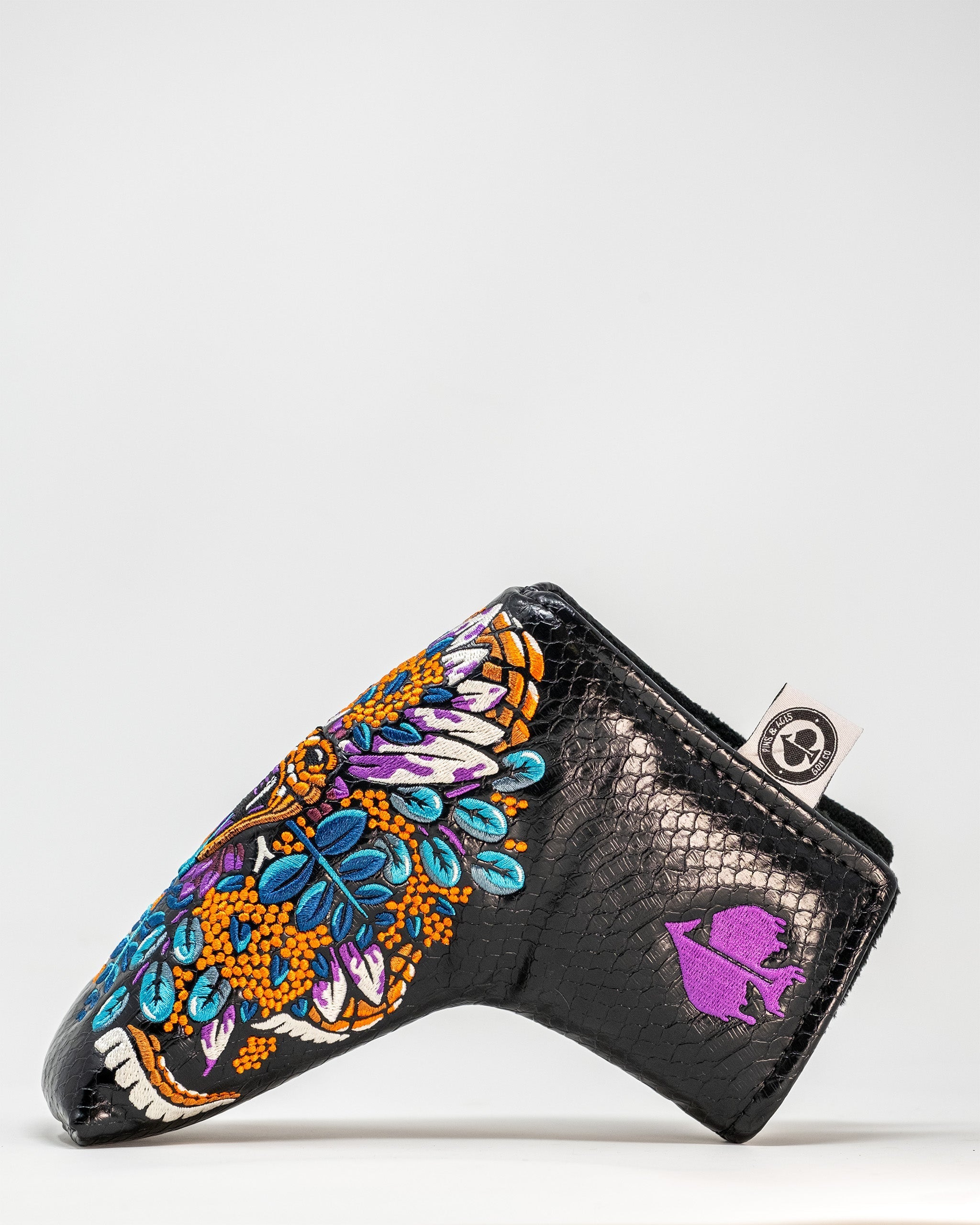 Bold Venom Blade Putter Cover featuring vibrant floral embroidery on a sleek black background, designed for standout golfers.