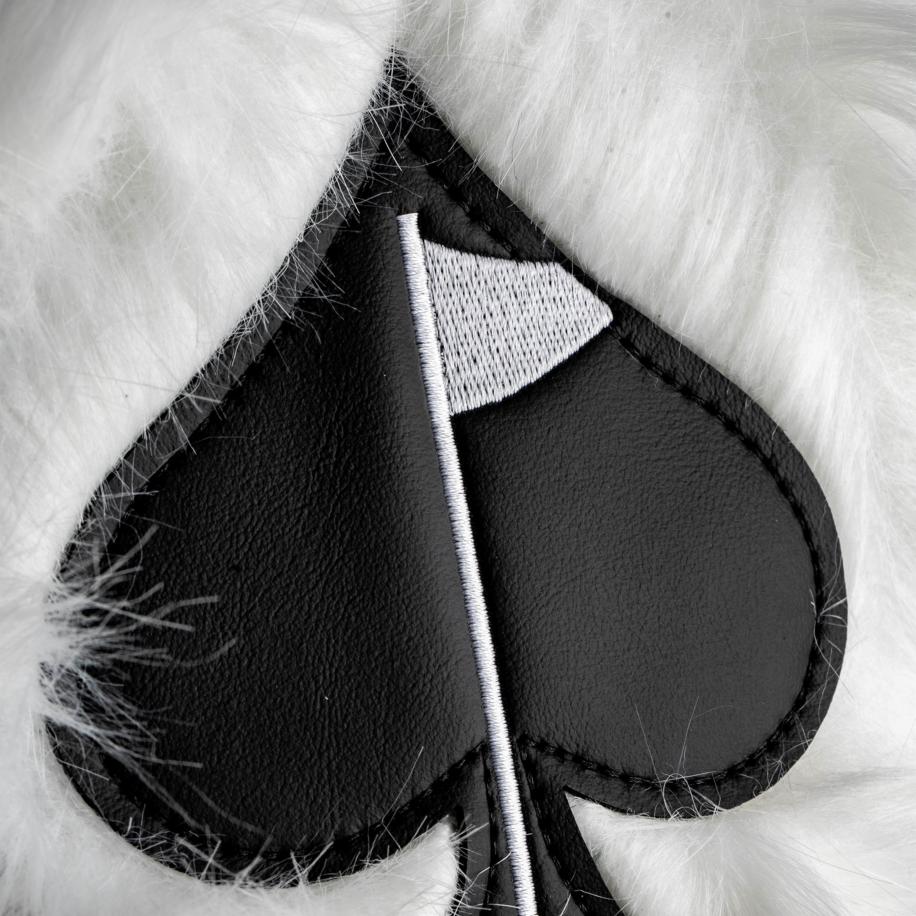 White fuzzy driver cover featuring a black spade design, perfect for golfers seeking a unique and stylish accessory.