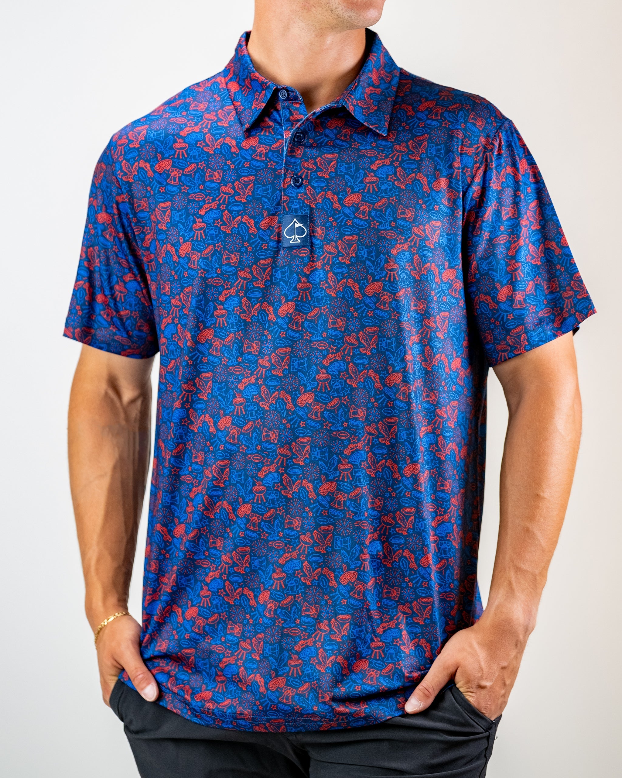 Navy golf polo featuring a vibrant red doodle pattern, designed for a stylish and bold look on the course.