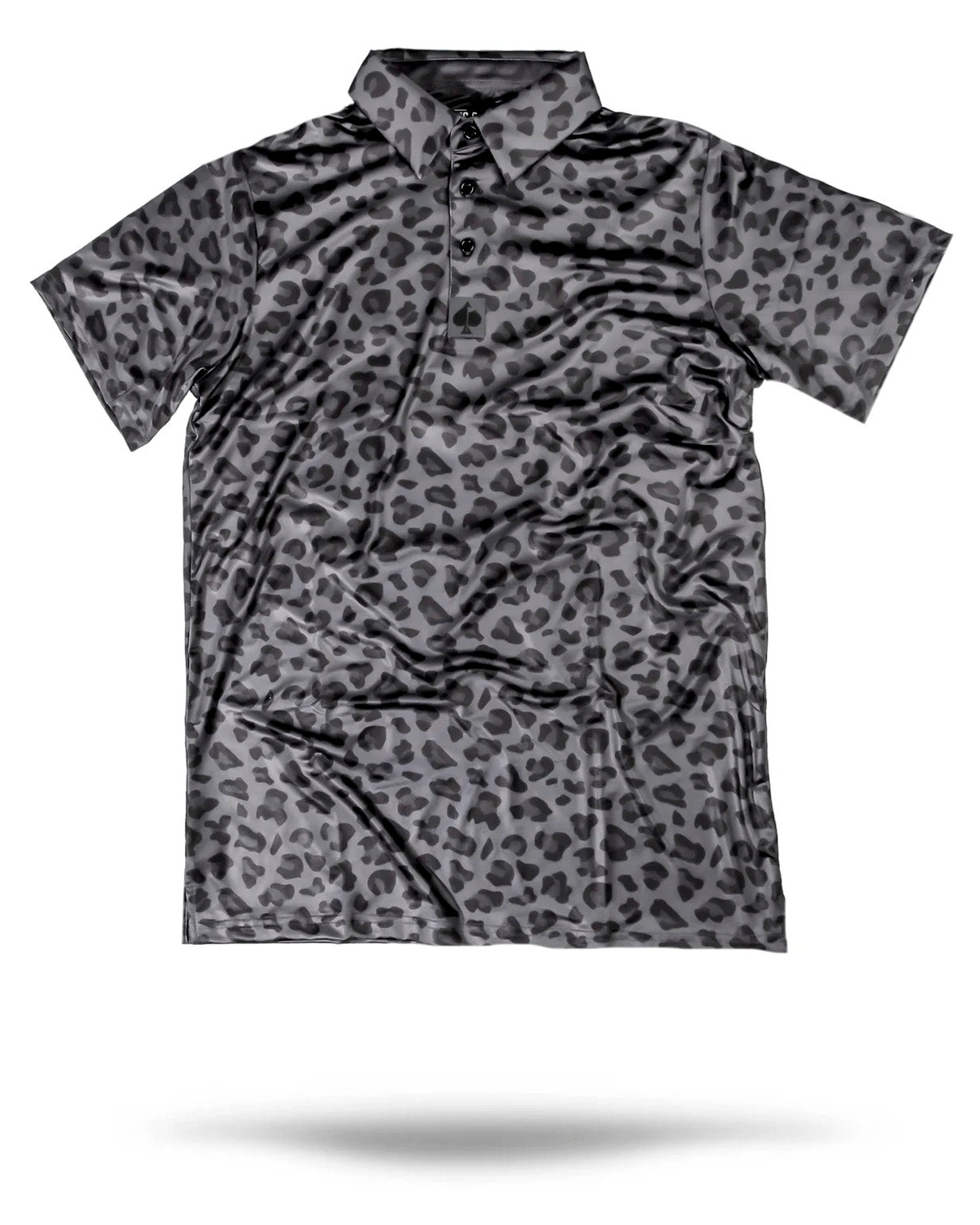 Black Jungle Cat resting among lush green foliage.