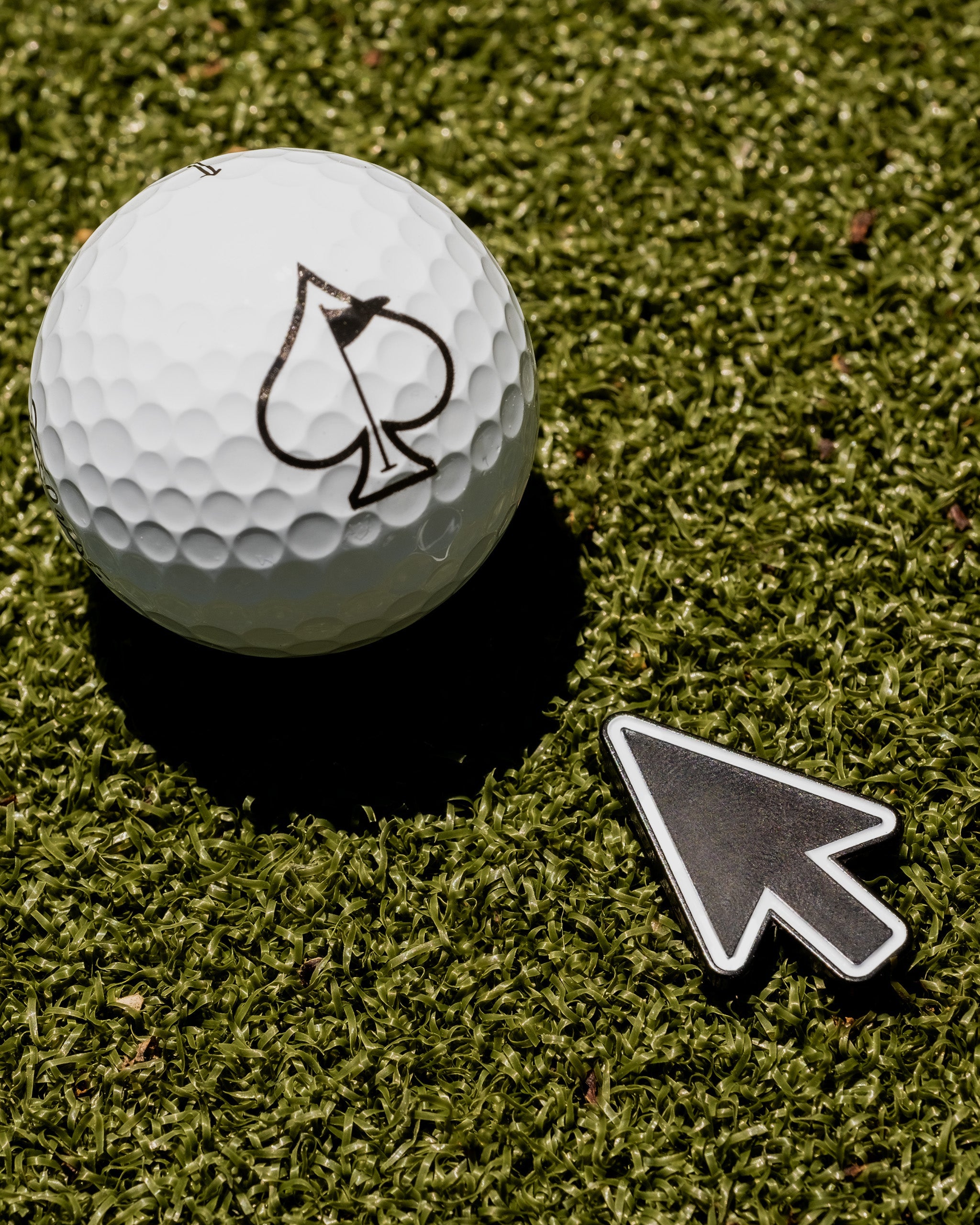 Classic Cursor Ball Marker featuring a sleek design and vibrant colors, ideal for golf enthusiasts.