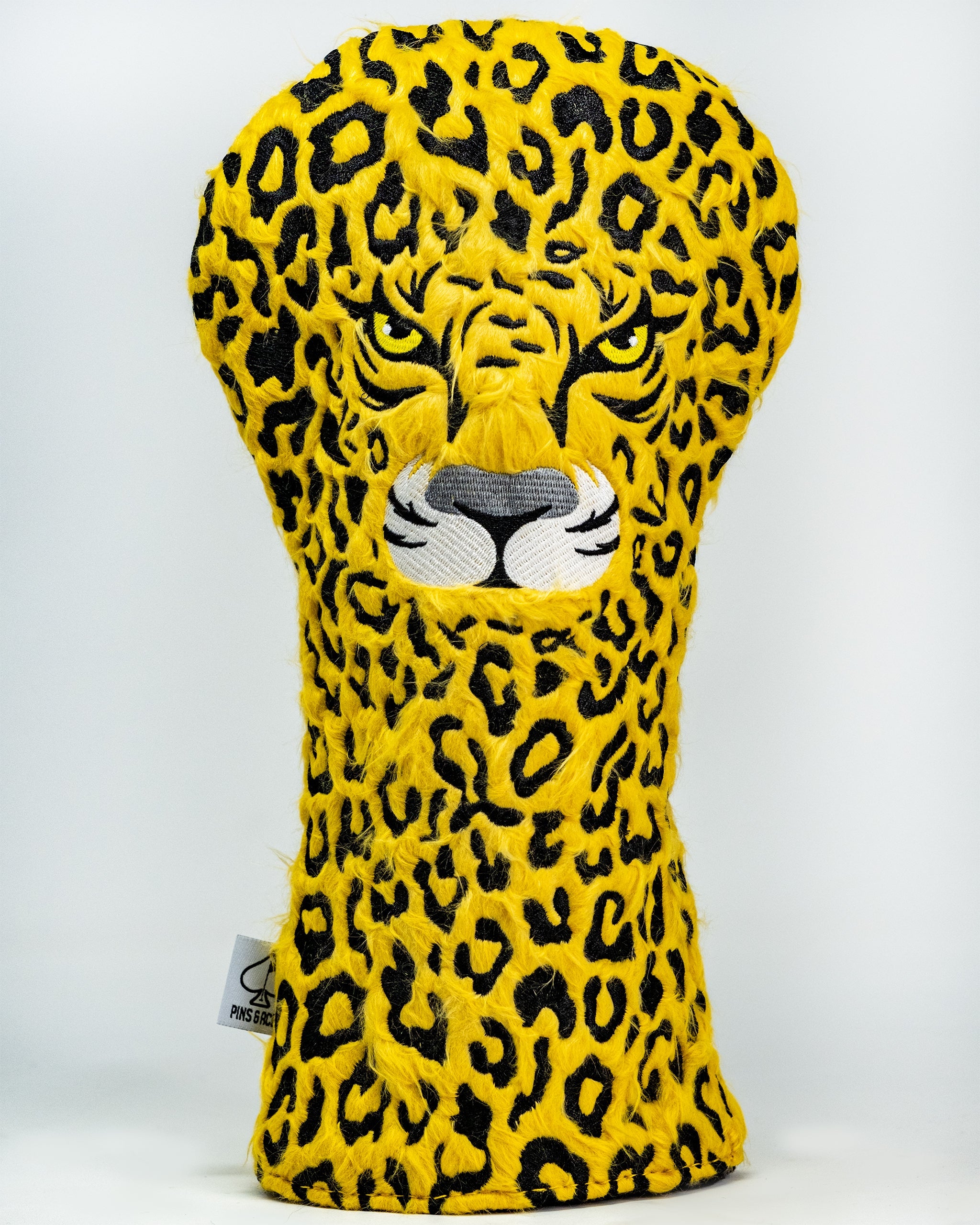 Leopard print golf driver cover with a plush design, featuring realistic leopard features.