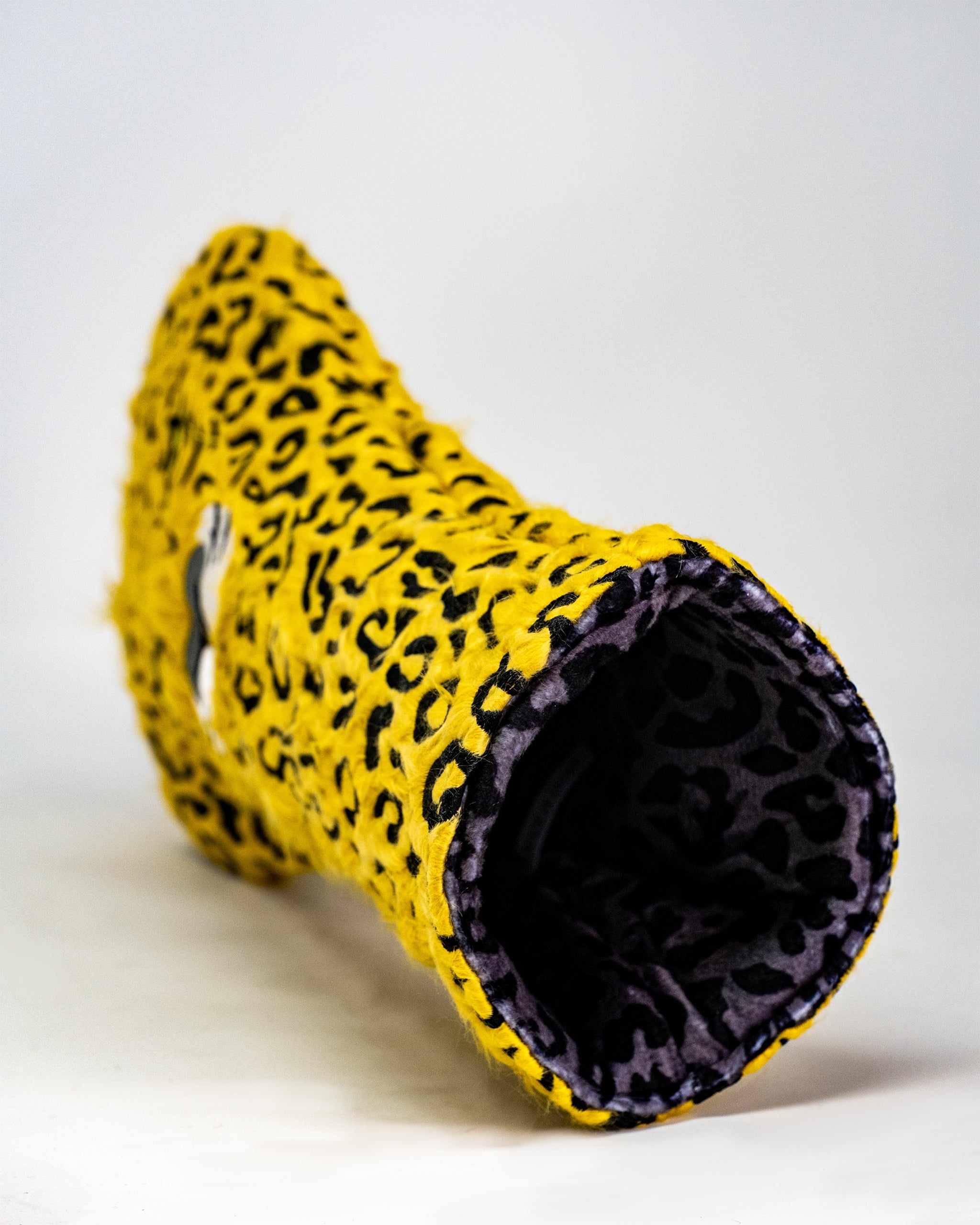 Leopard print golf driver cover with a plush exterior and protective design.