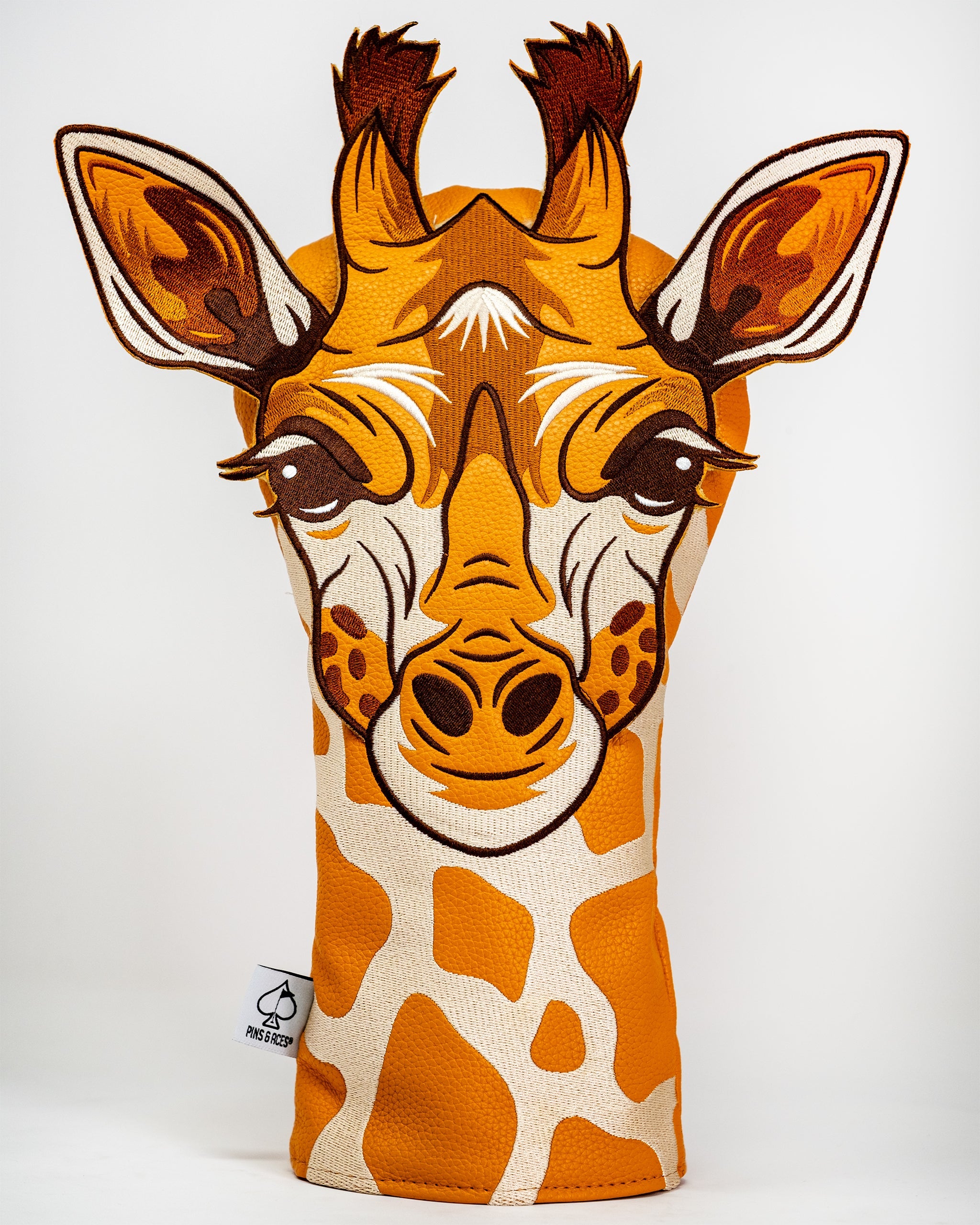 Giraffe golf driver cover featuring a colorful, plush design with realistic giraffe patterns.