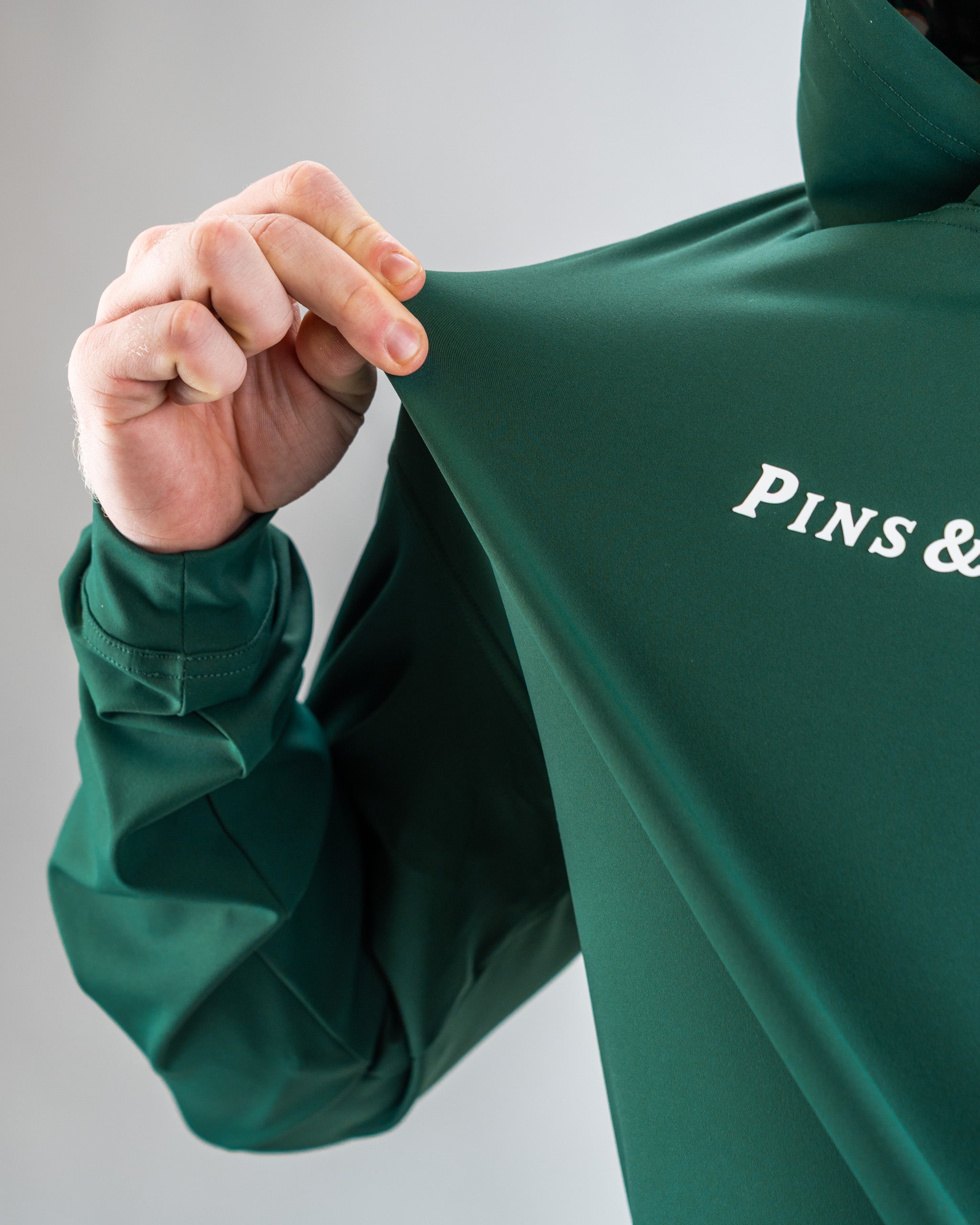 Performance Golf Hoodie in Pimento 4.0 color, featuring a modern design and relaxed fit, ideal for golfers looking for comfort and style on the course.