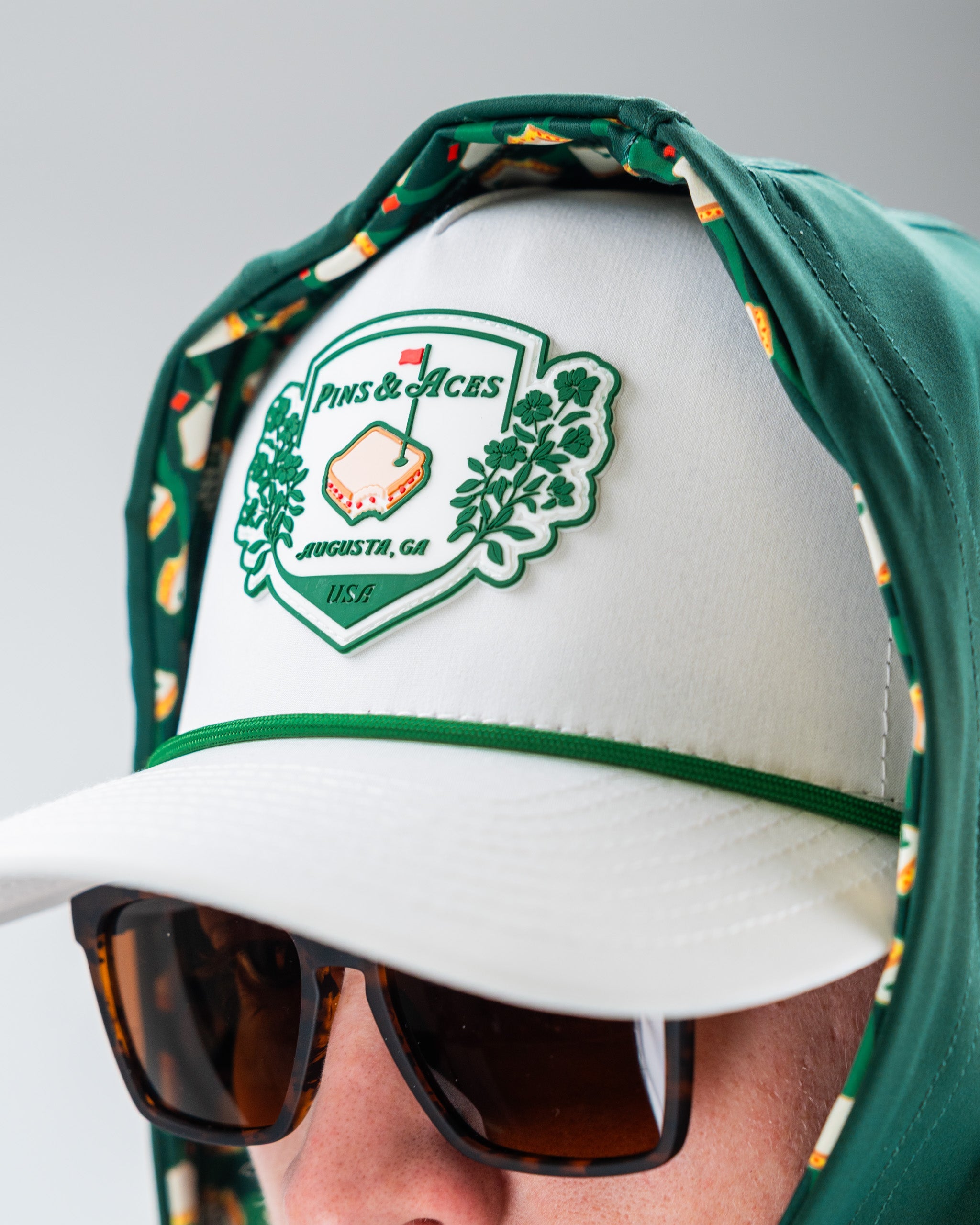 Performance Golf Hoodie in Pimento color, featuring a sleek design and breathable fabric, suitable for athletic wear.