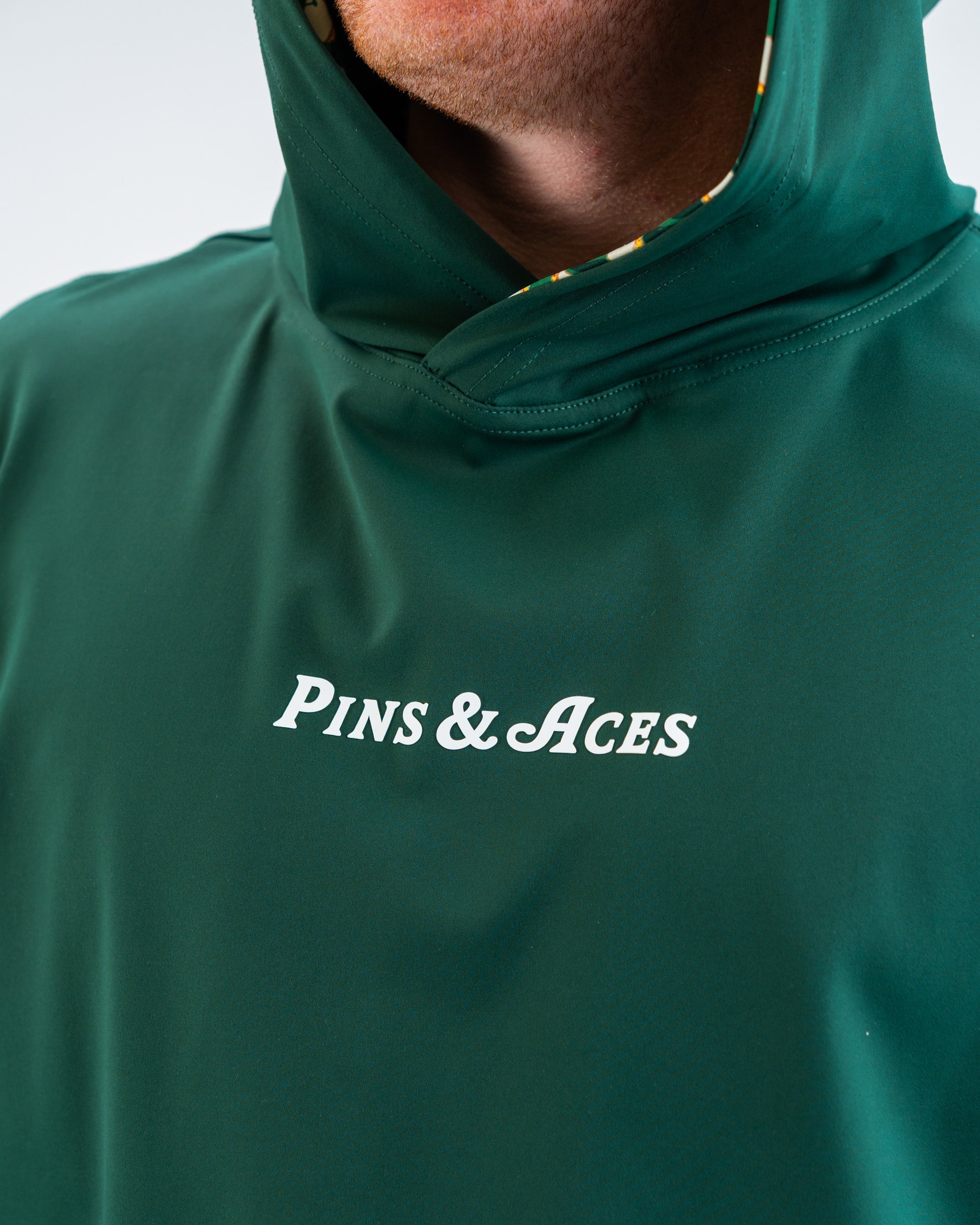 Performance Golf Hoodie in Pimento 4.0, featuring a sleek design and lightweight fabric, ideal for active wear on the golf course.