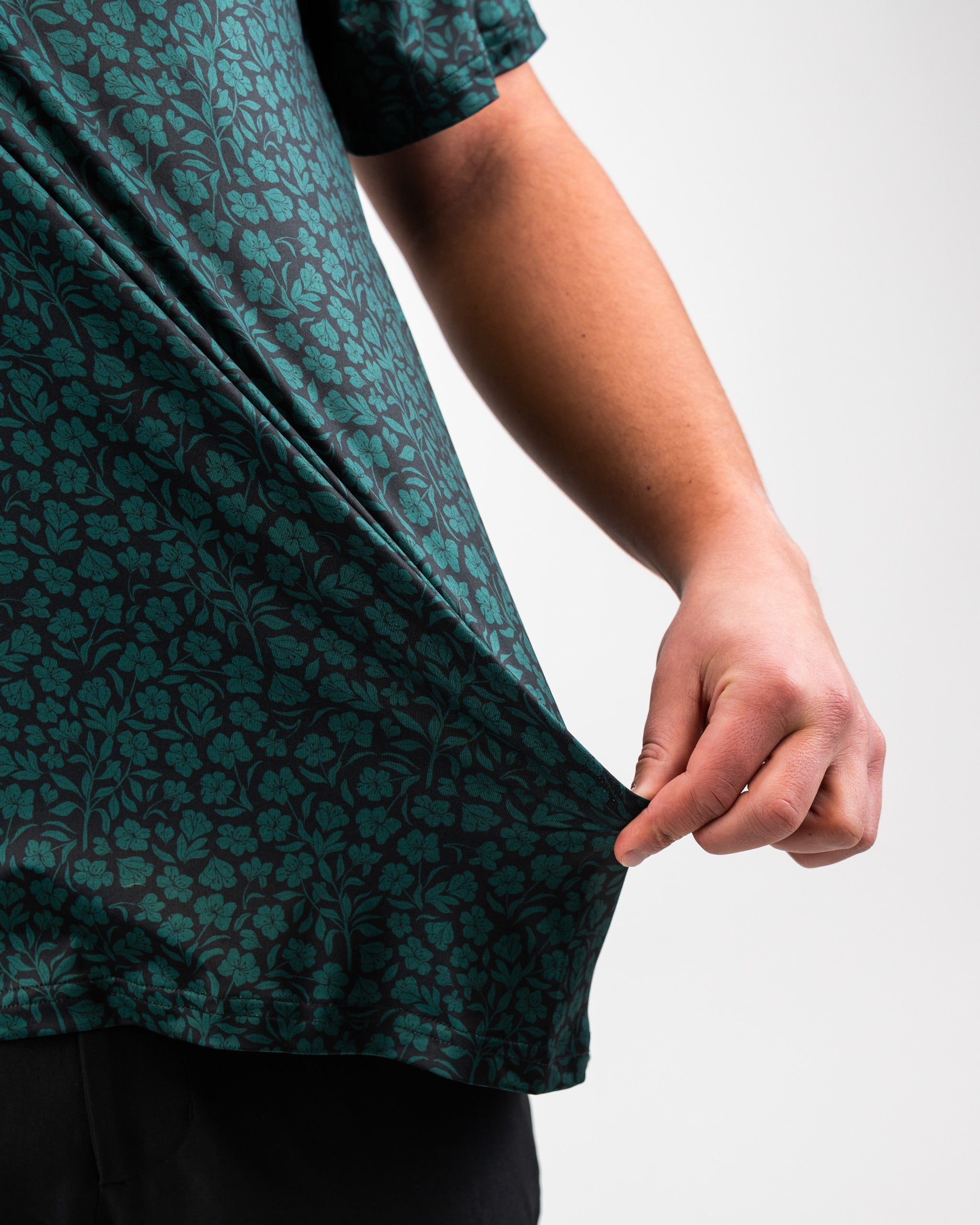 Hibiscus green women's t-shirt with short sleeves displayed on a white background.