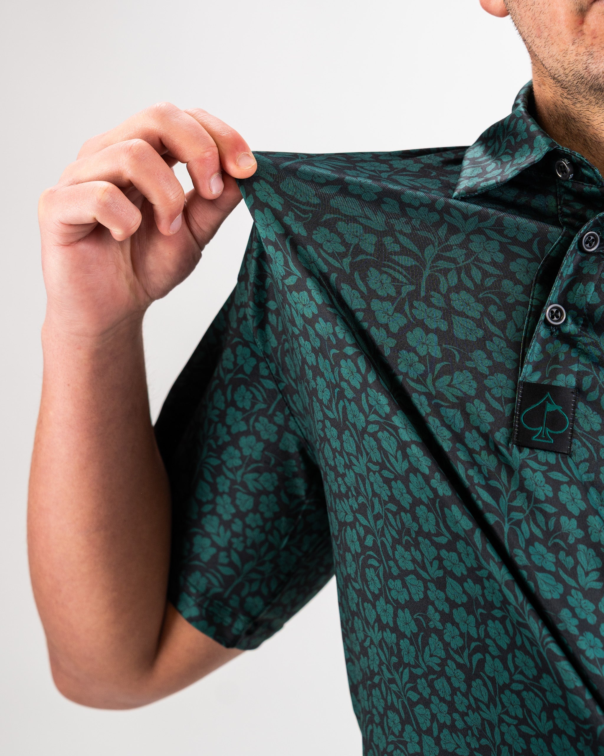 Hibiscus green floral design on lightweight fabric.