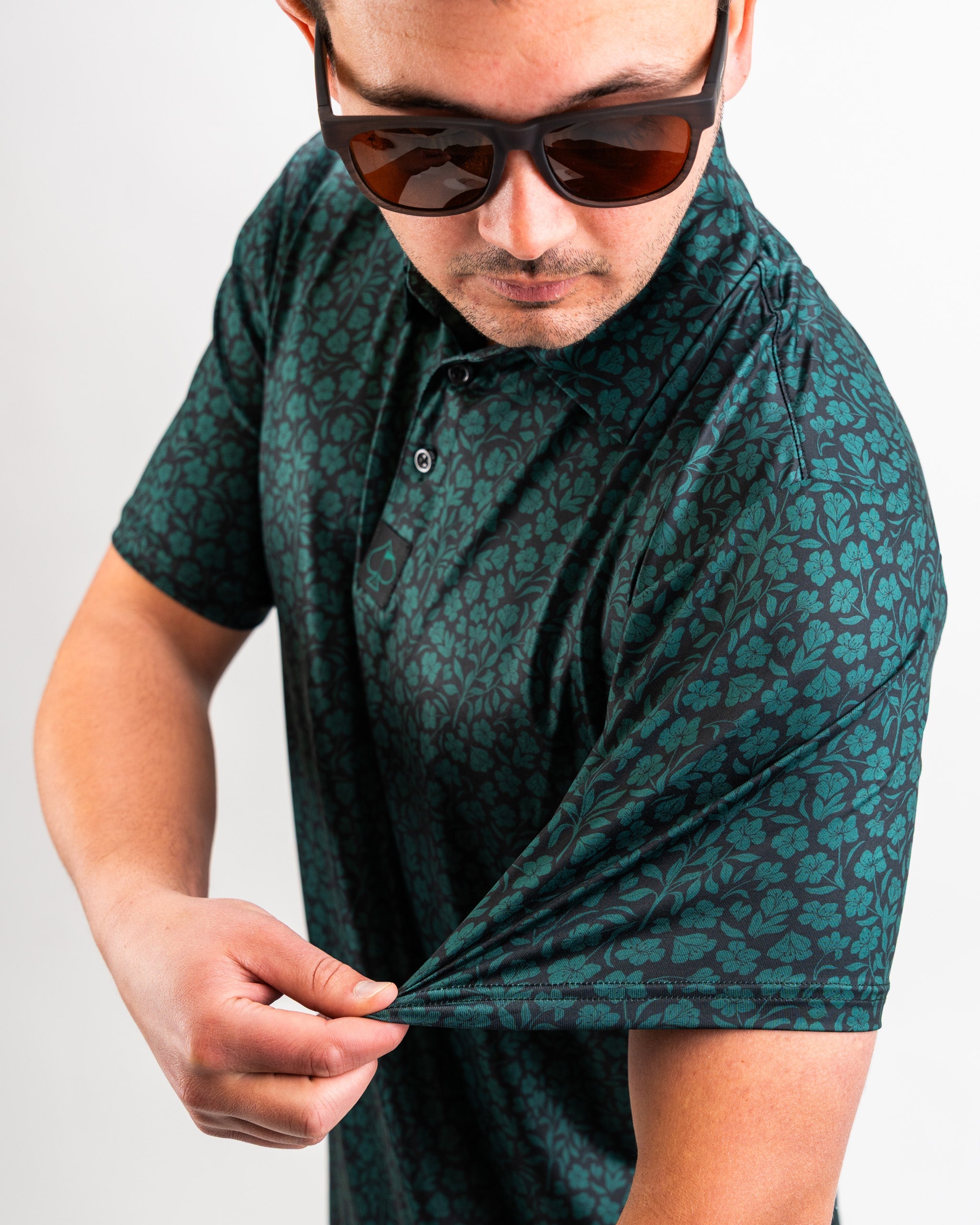Hibiscus green fabric swatch showcasing a vibrant floral print perfect for apparel design.