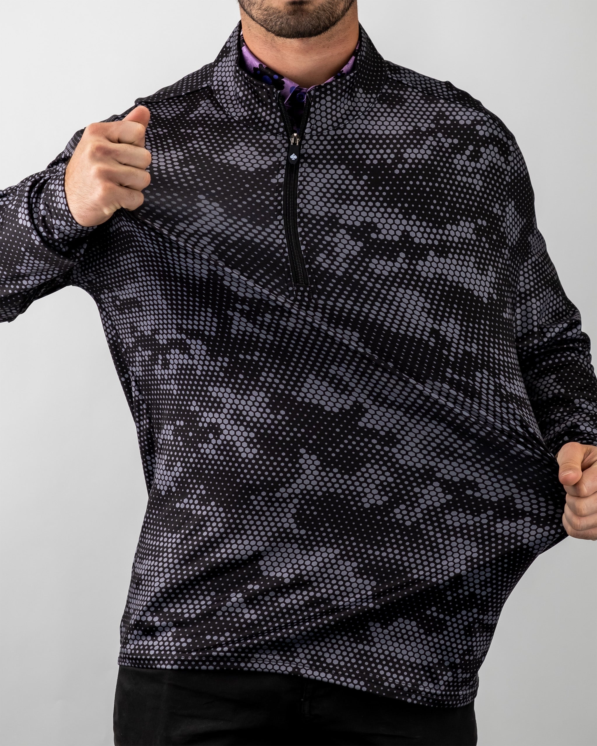 Men's black hex Digi pullover with a quarter-zip collar and a geometric dotted pattern, worn by a model.