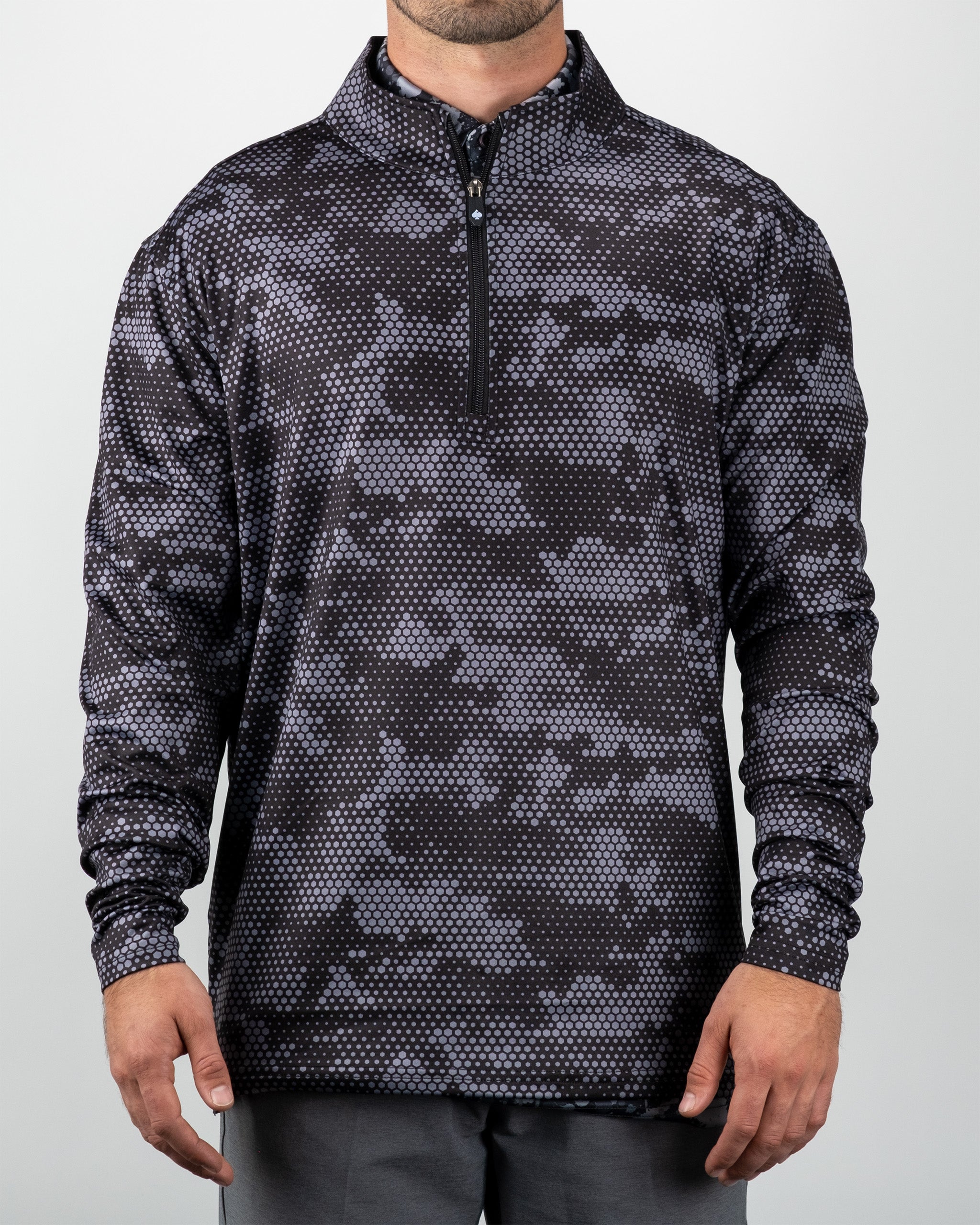 Black hexagonal digi pullover with a quarter-zip collar, featuring a pixelated camouflage pattern in shades of black and gray.