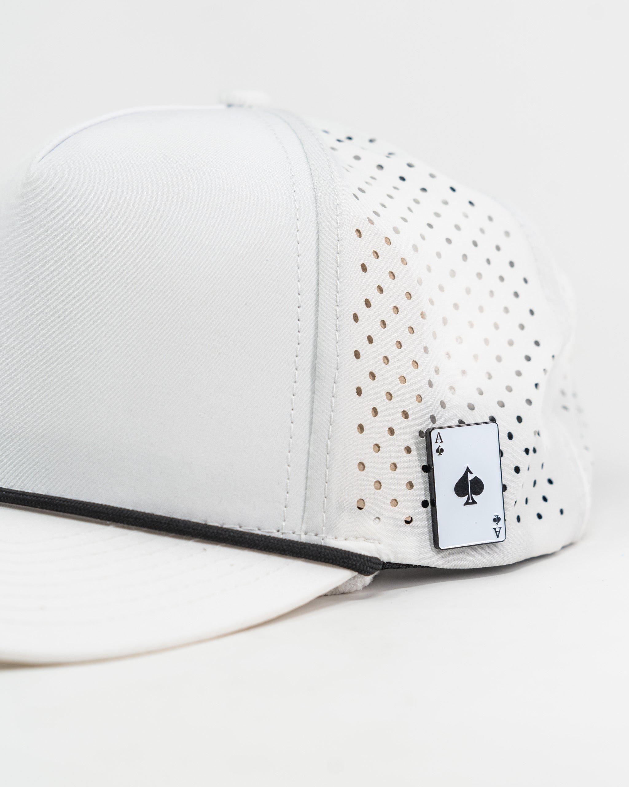 Perforated white rope hat featuring Zynbabwe Country Club logo.