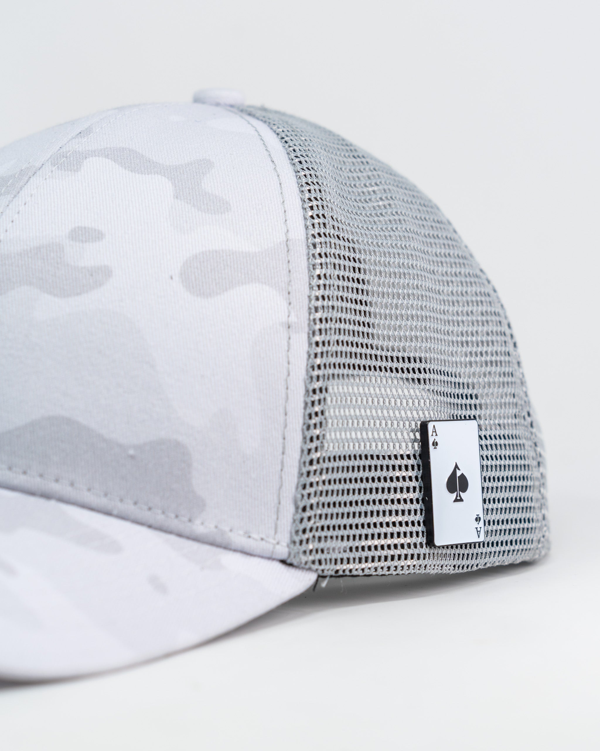 Trucker hat in Arctic Camo design, featuring a mesh back and adjustable snap closure.