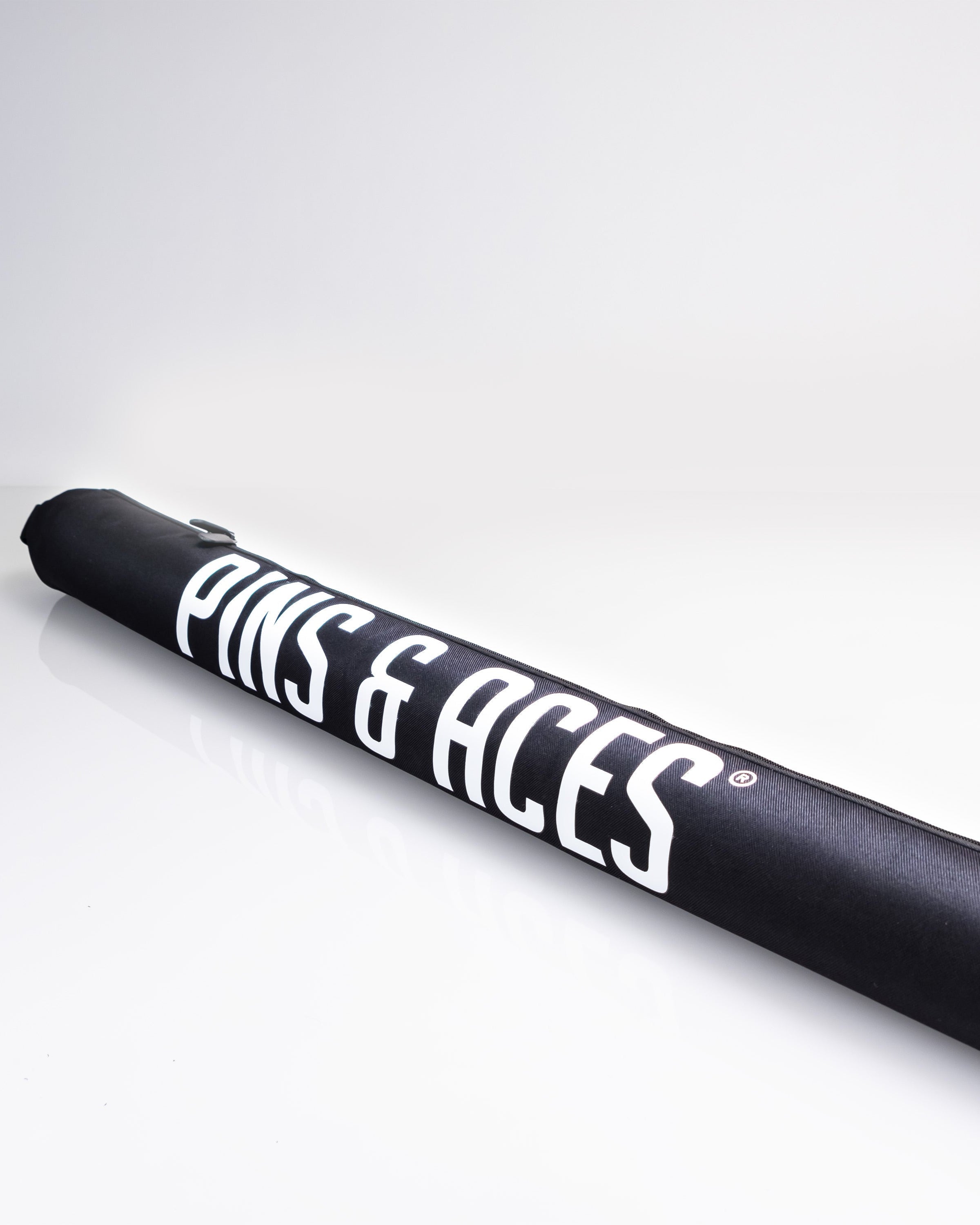 Golf club headcover in black with white "FINS & ACES" logo, part of the golfer gift pack in olive, designed for tailgate events.