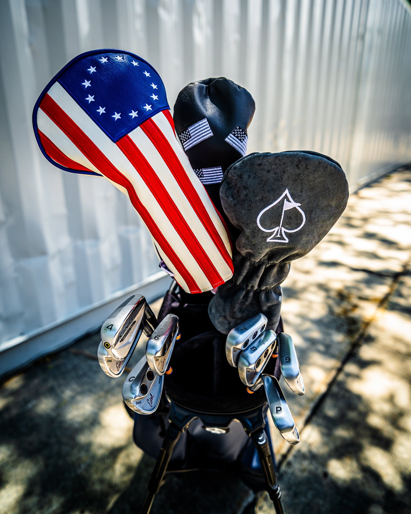 Betsy Ross driver cover featuring a vibrant design of dancing USA flags, perfect for golf enthusiasts.