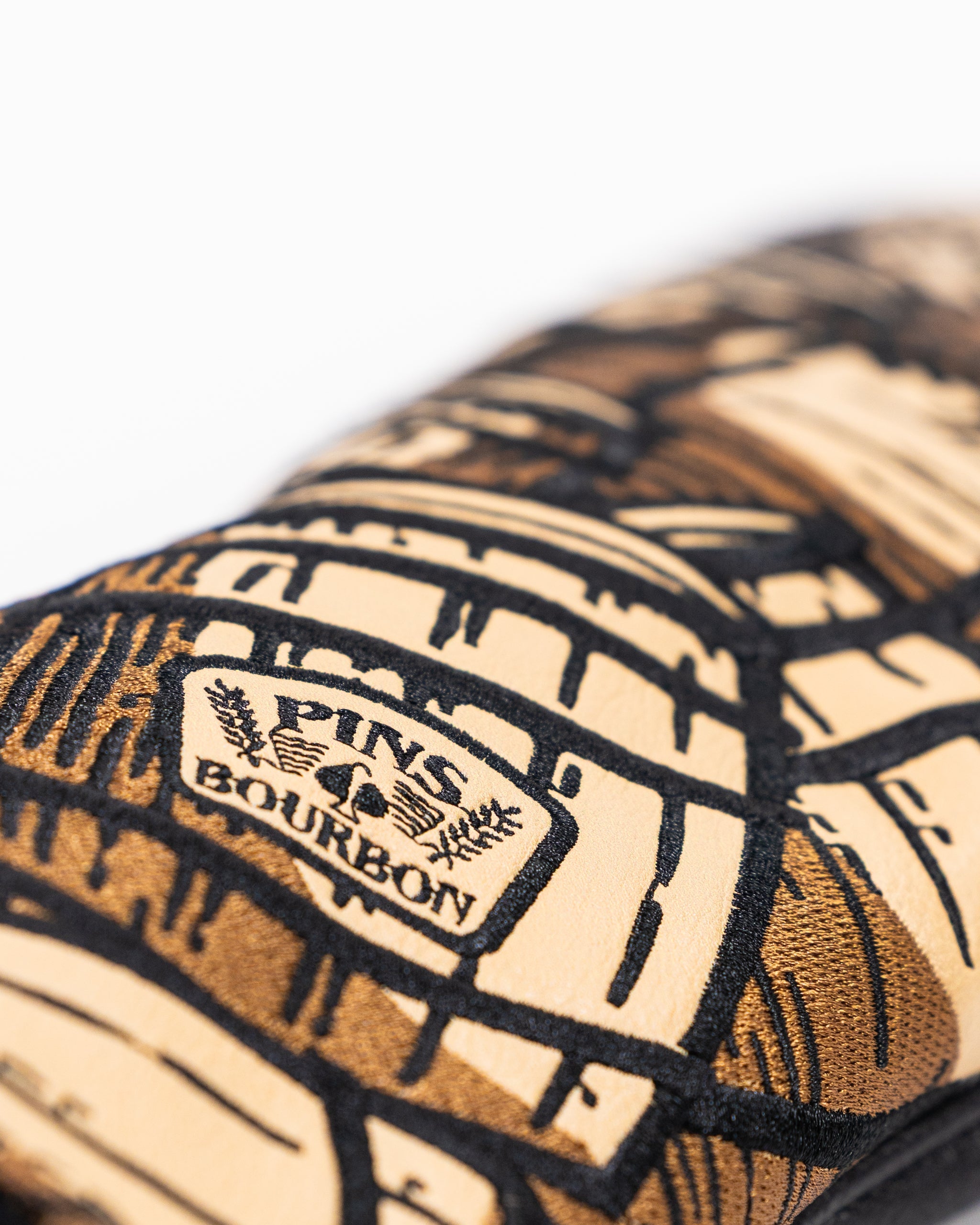 Bourbon Barrel Driver Cover featuring a rustic design with a dark brown color and textured finish, ideal for golf enthusiasts.