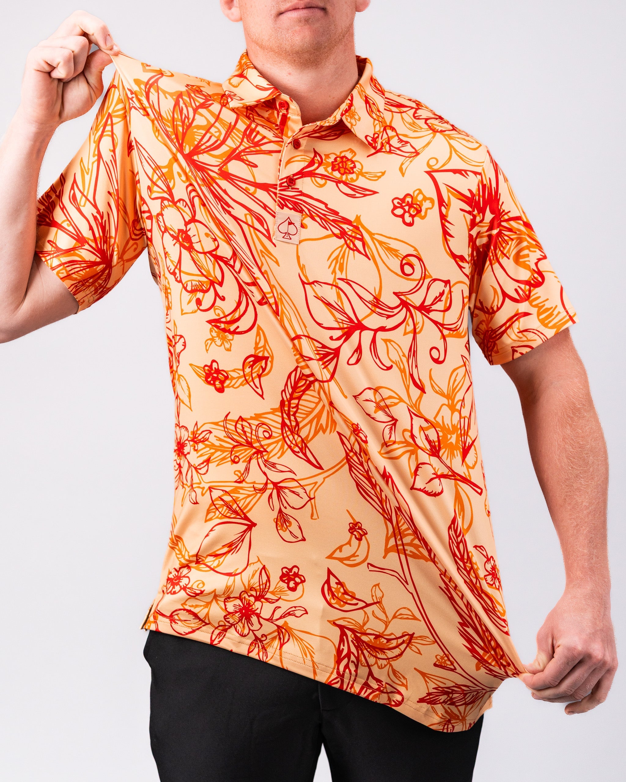 Cabo Sunburst polo shirt featuring a vibrant yellow and orange gradient design.