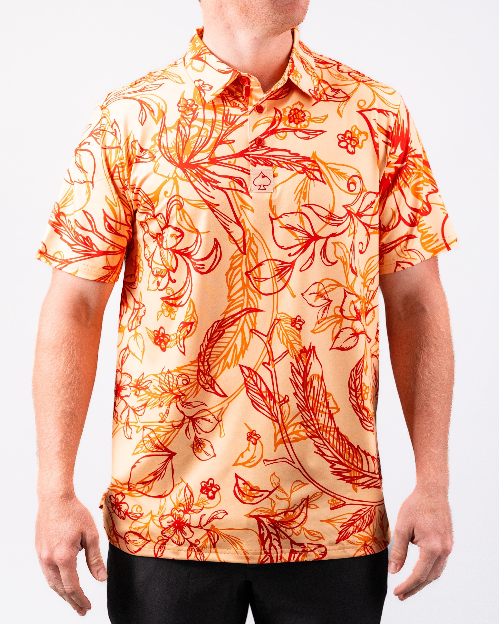 Cabo Sunburst polo shirt featuring a vibrant sunburst pattern in orange and yellow hues.