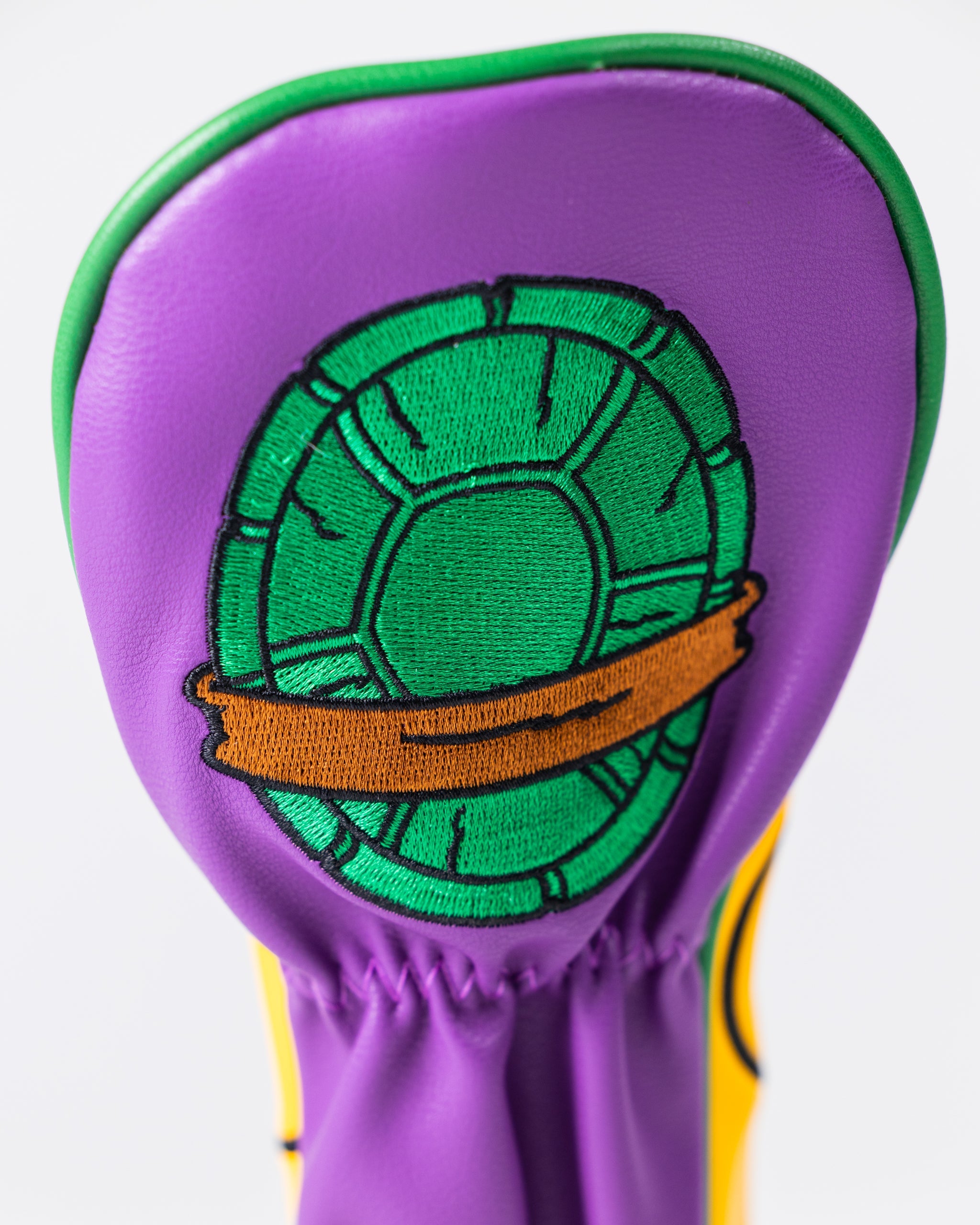 TMNT Donatello Hybrid Cover featuring vibrant artwork of the character against a dynamic background, showcasing his signature purple mask and weapon.