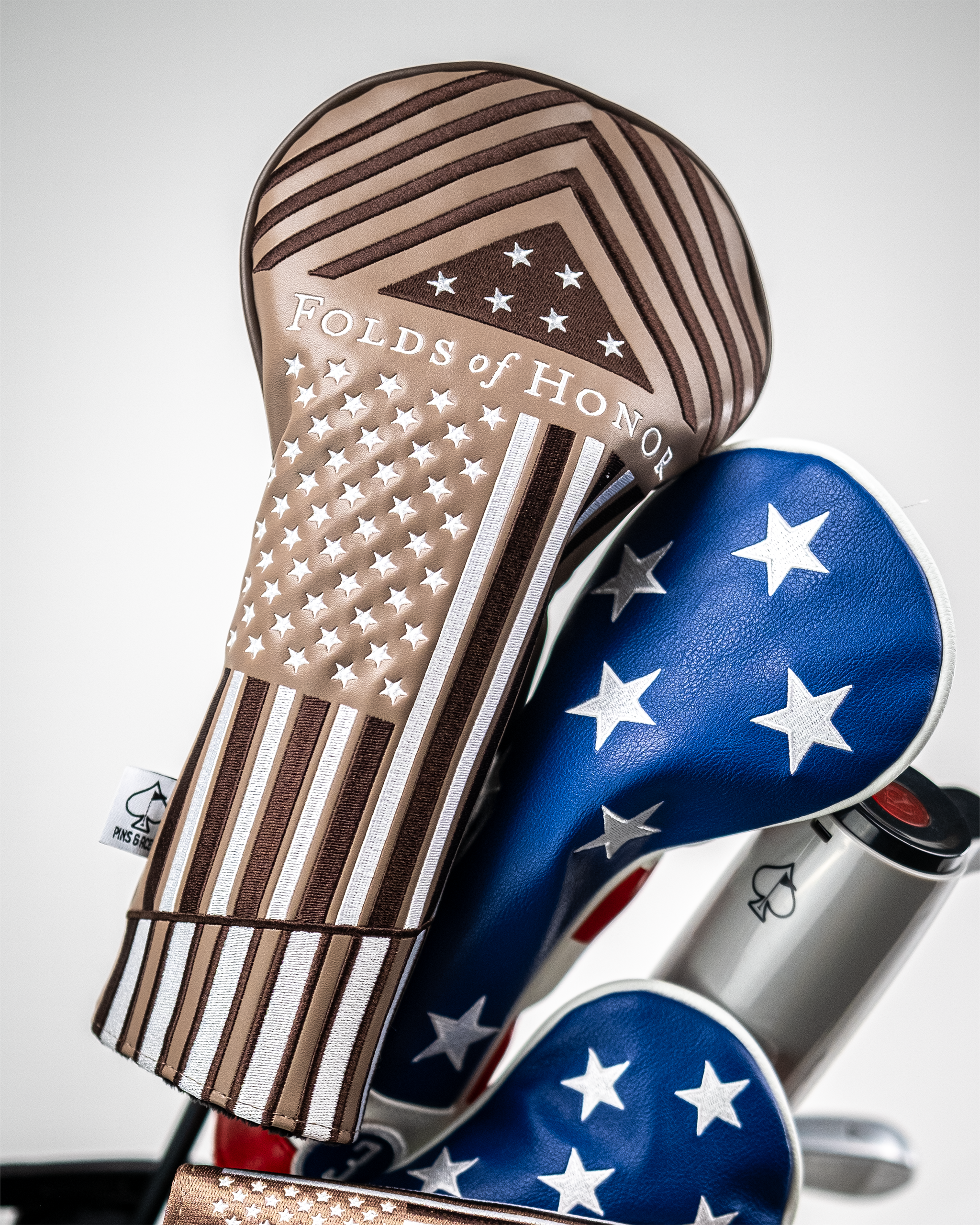 Folds of Honor 2.0 driver cover featuring a sleek design with patriotic colors and logo, designed to protect golf clubs.