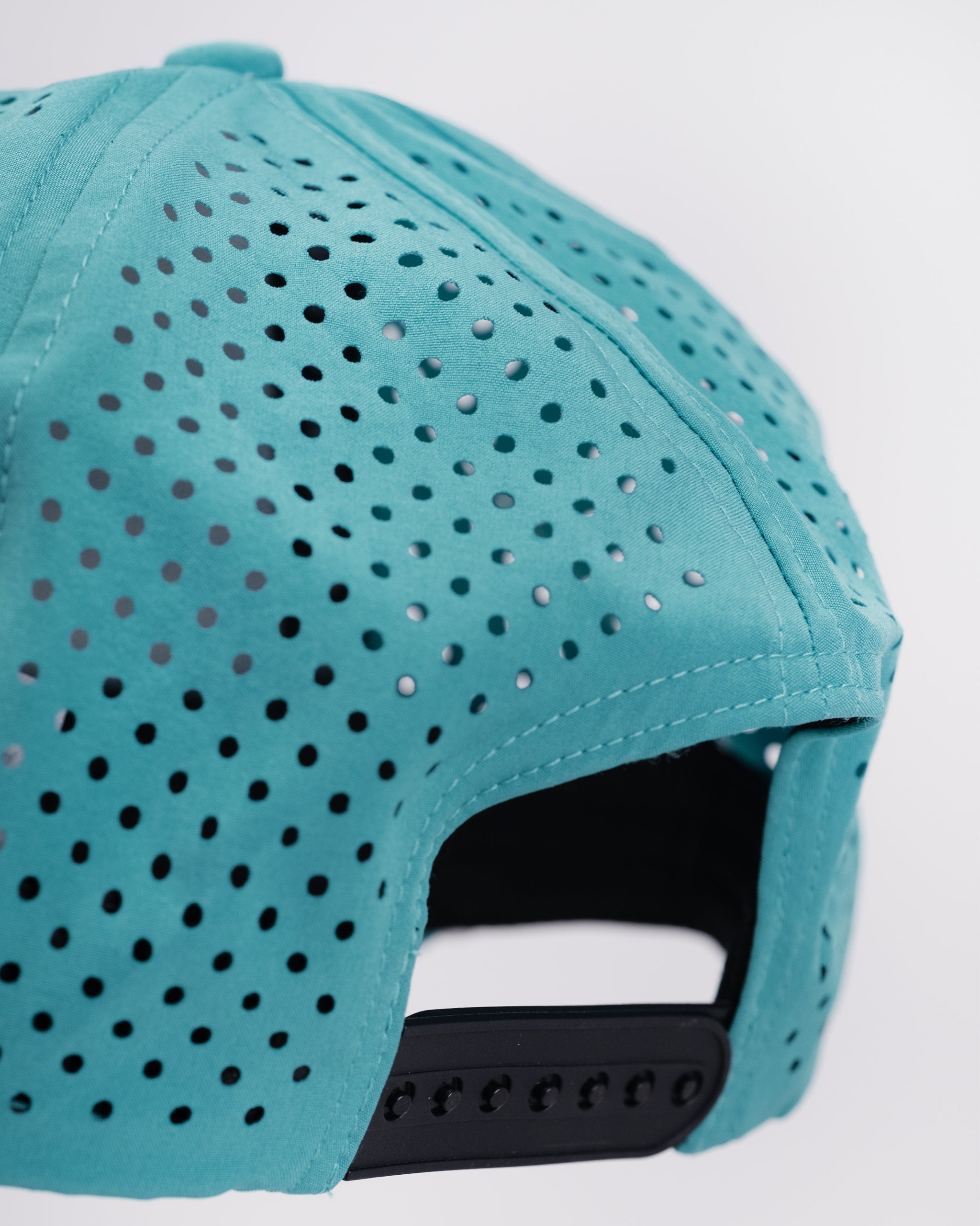 Perforated baby blue rope hat featuring a stylish design and adjustable strap.